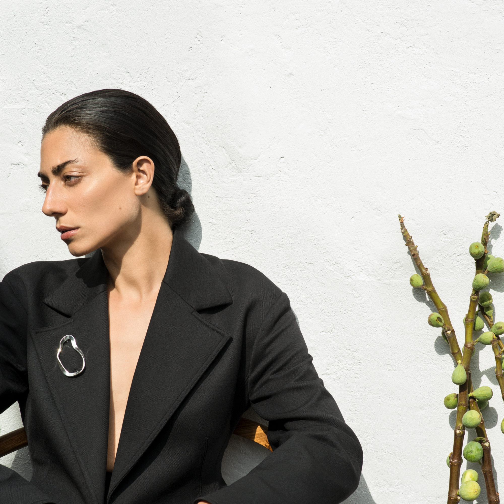 Woman wearing the AGMES .925 Sterling Silver Structural Vera Brooch.