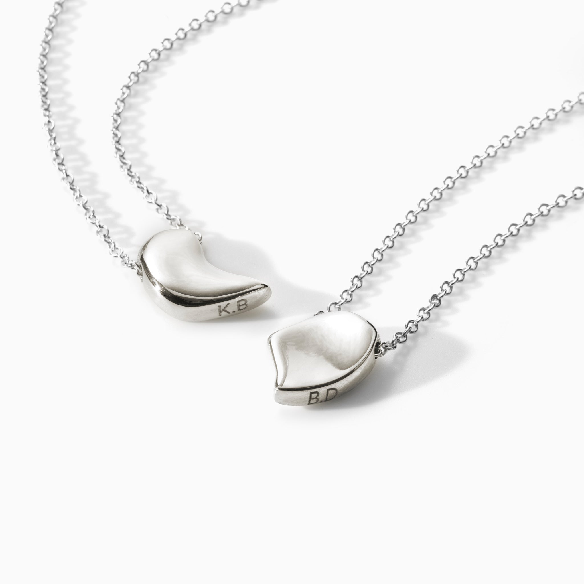 AGMES .925 Sterling Silver Sum of Parts Pendant Set. Modern connecting heart necklace with engravings.
