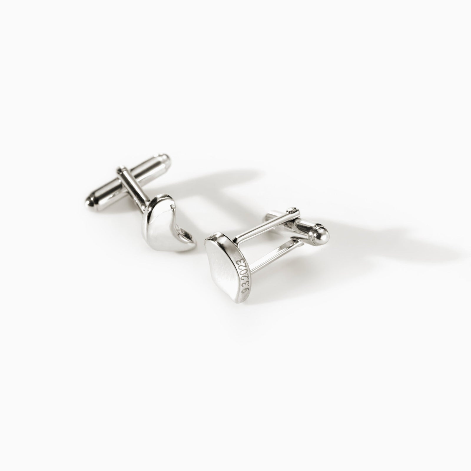 AGMES .925 sterling silver sculptural heart Sum of Parts Cufflinks on white background.