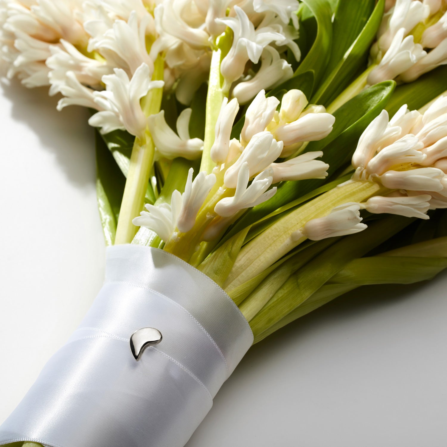 AGMES .925 Sterling Silver Sum of Parts Mini Brooch displayed on Bouquet.