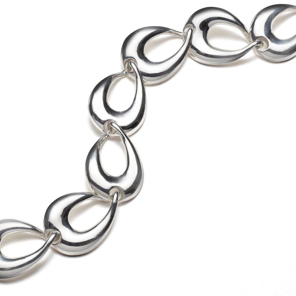AGMES .925 sterling silver sculptural link bracelet on white background.
