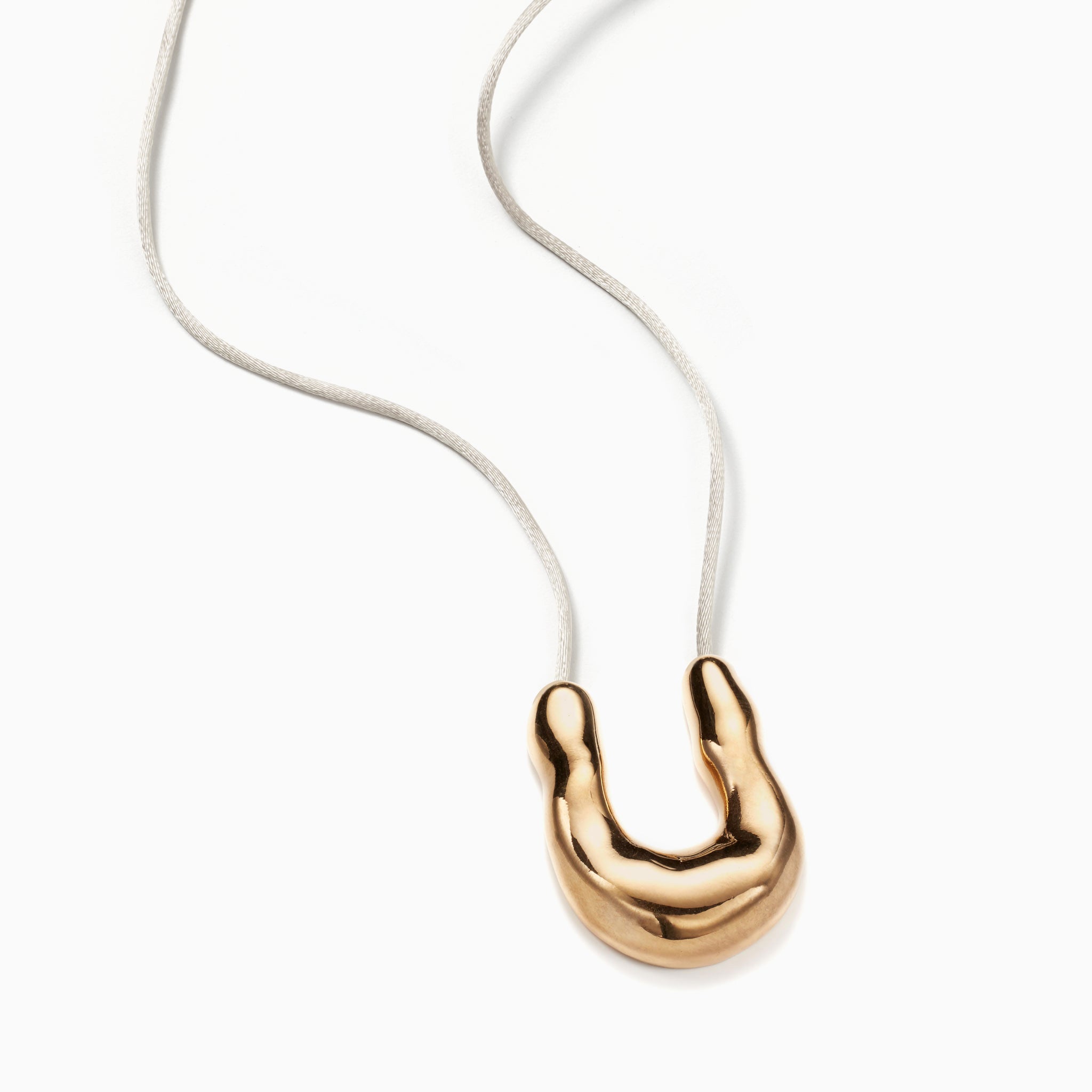 AGMES 18k Gold Vermeil Wishbone Pendant on Ivory Satin Cord.