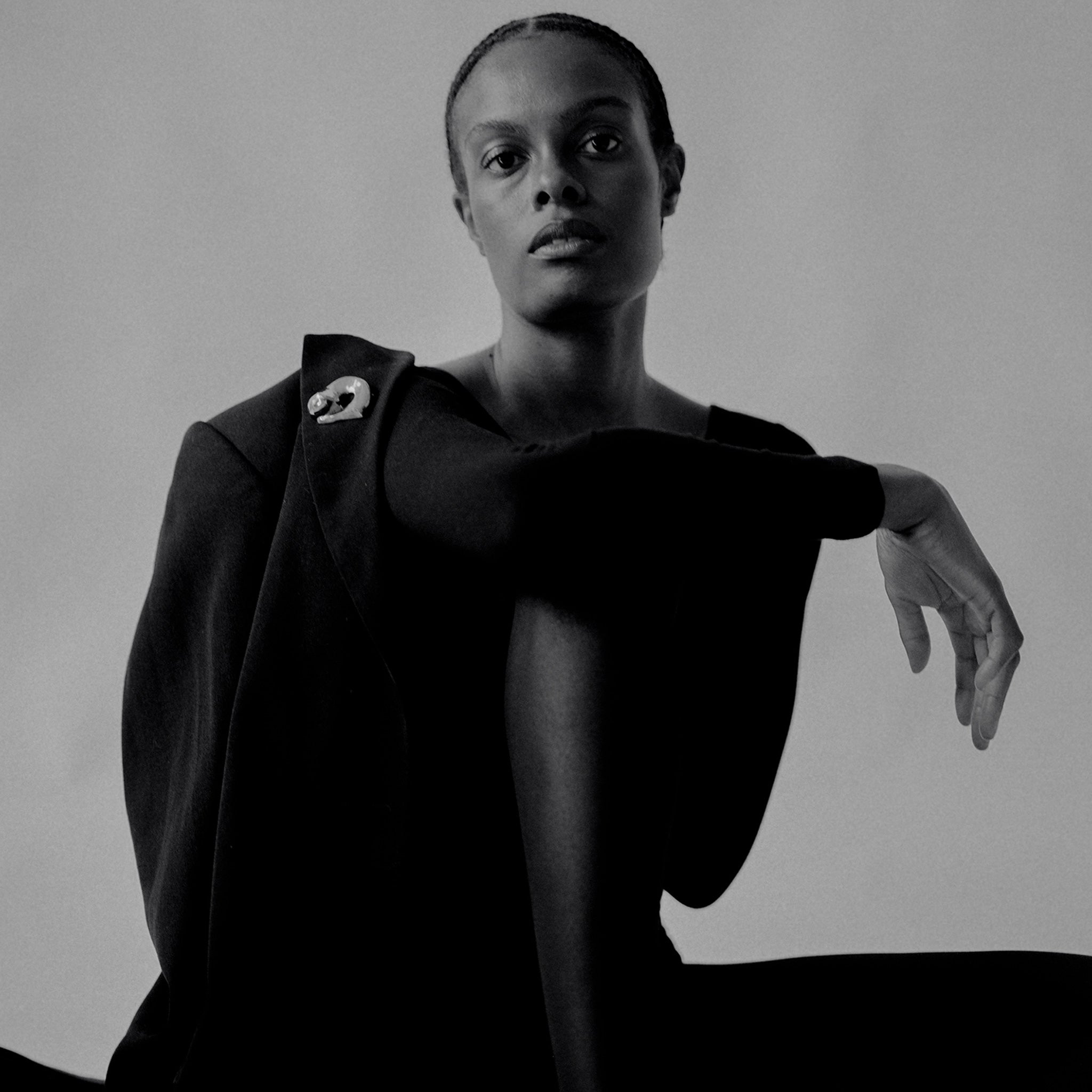 Woman wearing AGMES .925 Sterling Silver Gertrude Brooch on black blazer. Simone Bodmer-Turner.