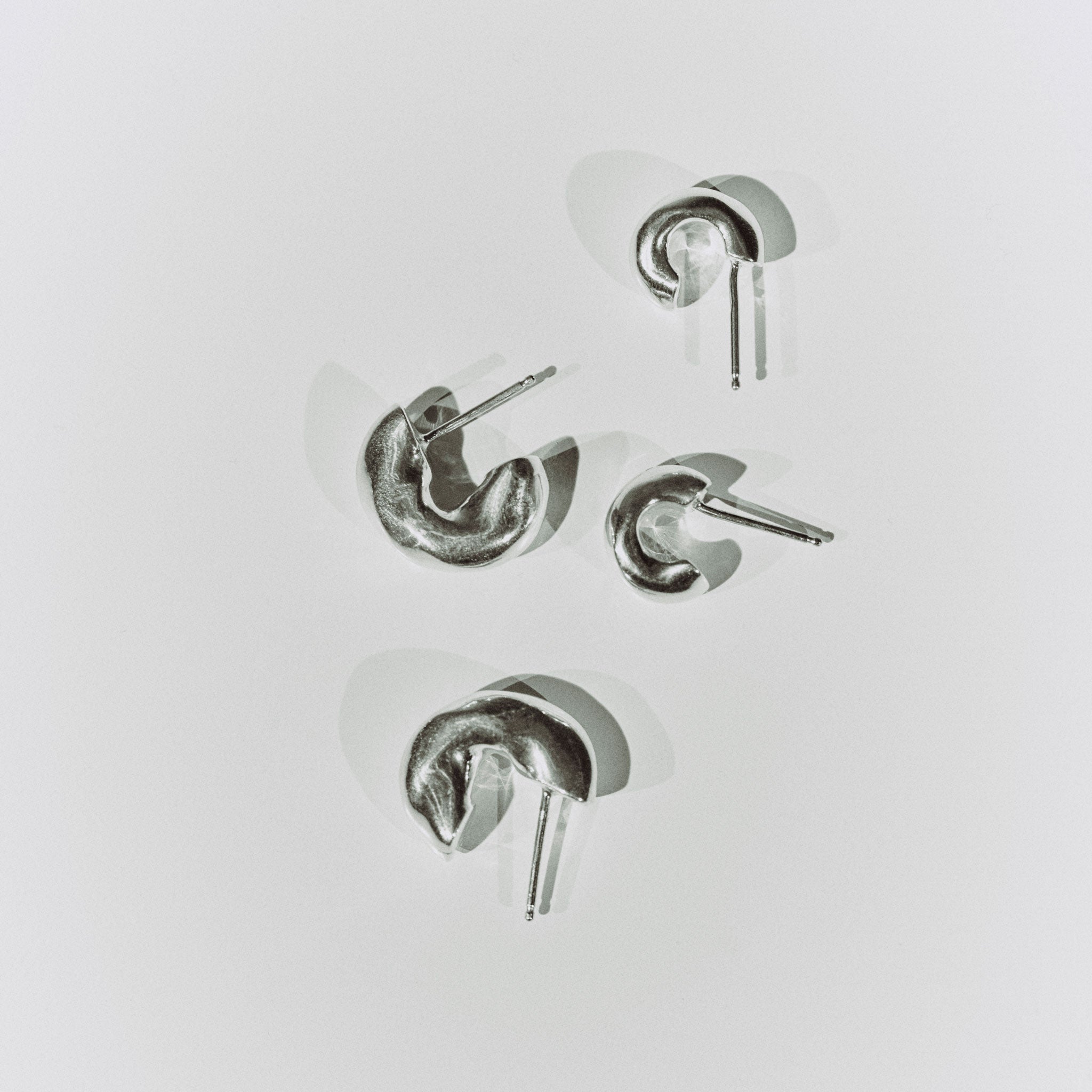 AGMES 0.925 sterling silver thick hoop huggie earrings.