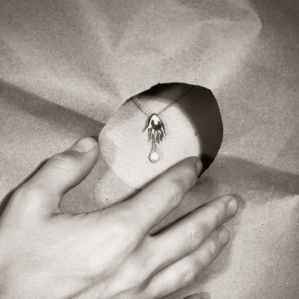 AGMES .925 Sterling Silver mini lee abstract hand pendant with freshwater pearl drop.