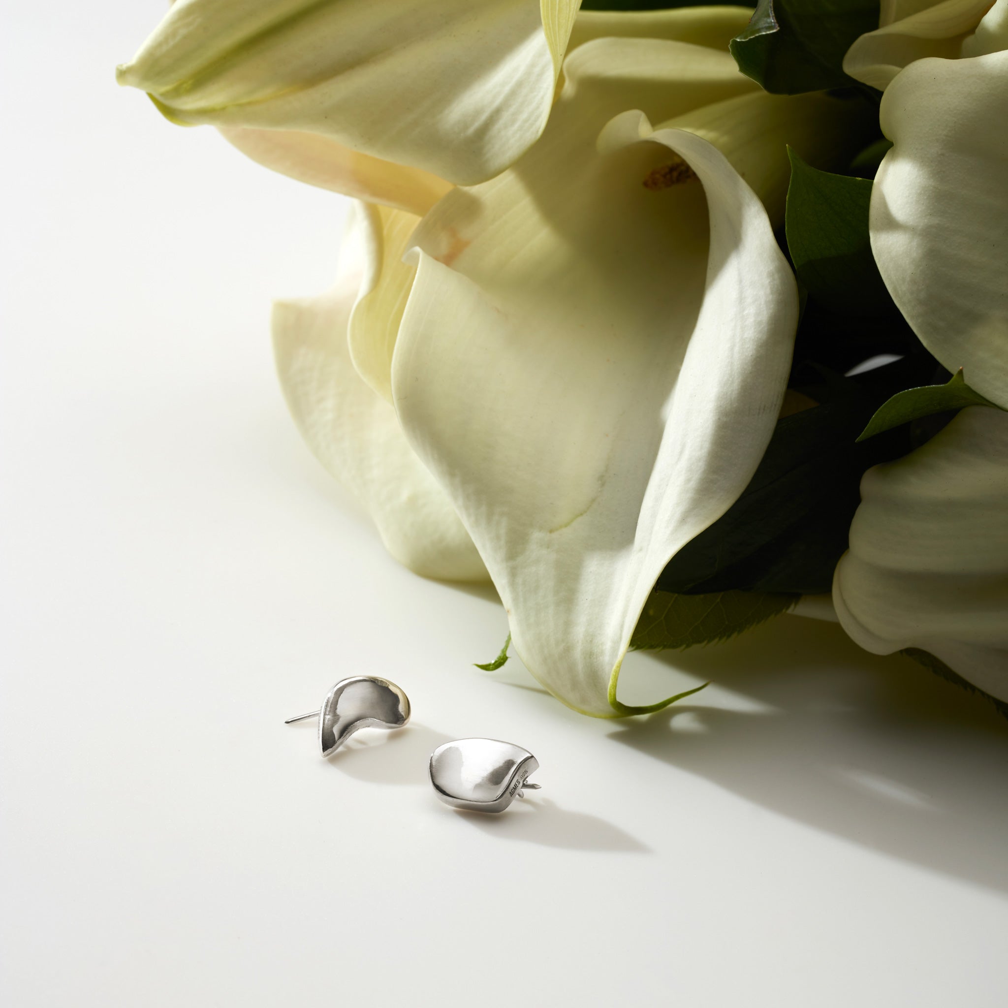 AGMES .925 Sterling Silver Sum of Parts Brooch Set displayed near white flowers. Set of Two.