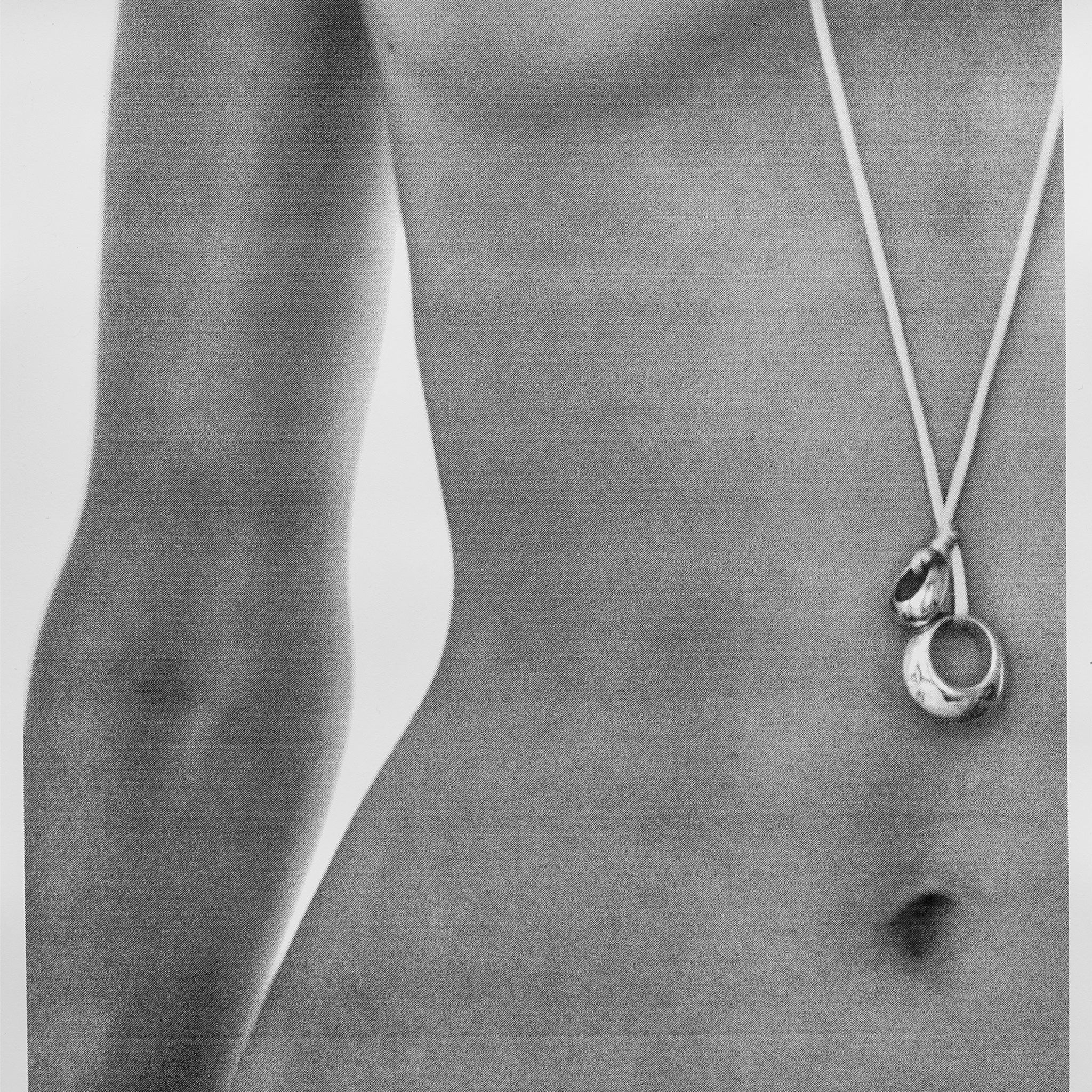 AGMES 18K Gold Vermeil Rae Pendant with Ivory Silk Cord necklace displayed on woman's stomach.