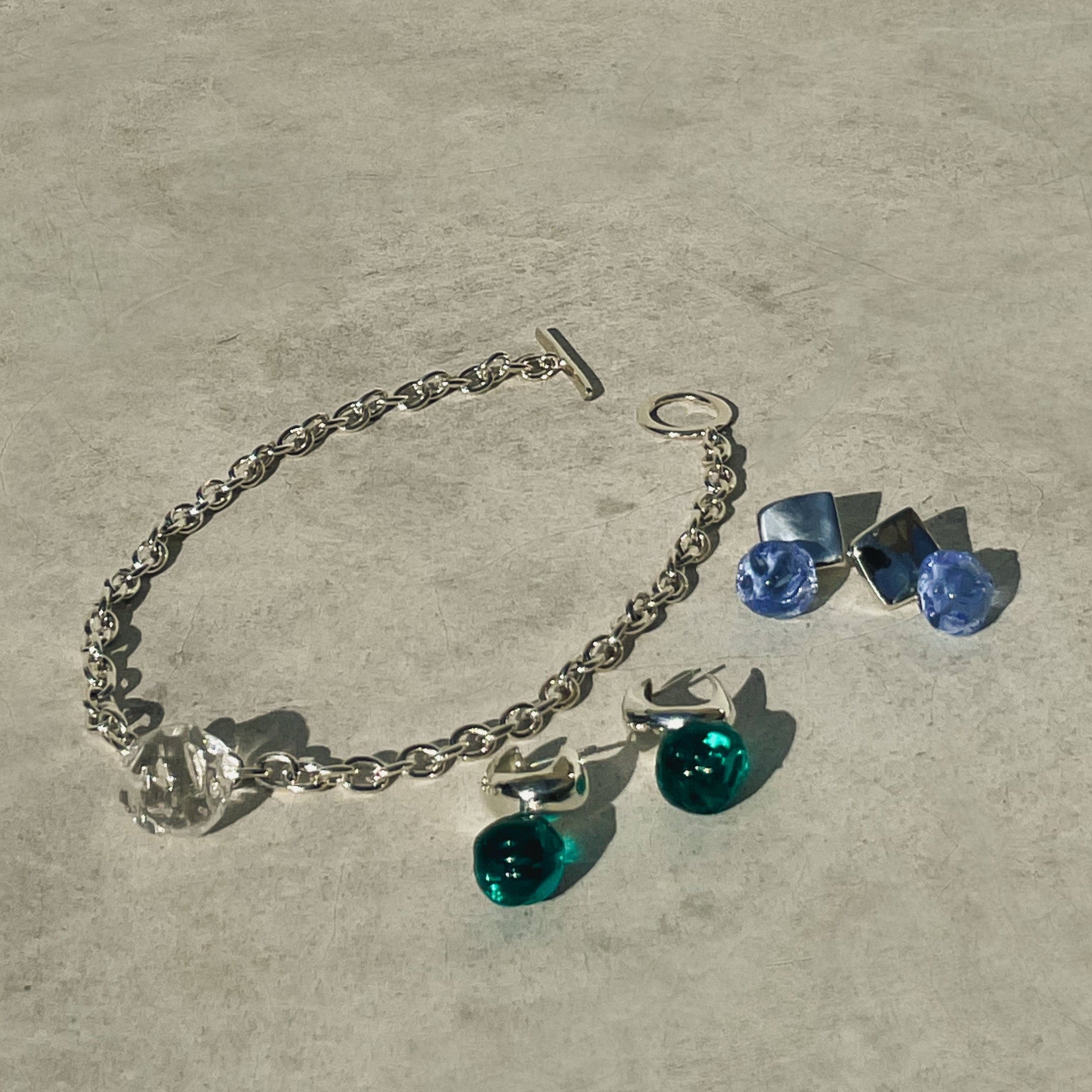 AGMES 0.925 sterling silver small Cleo hoop earrings with blue and green glass bead drop.