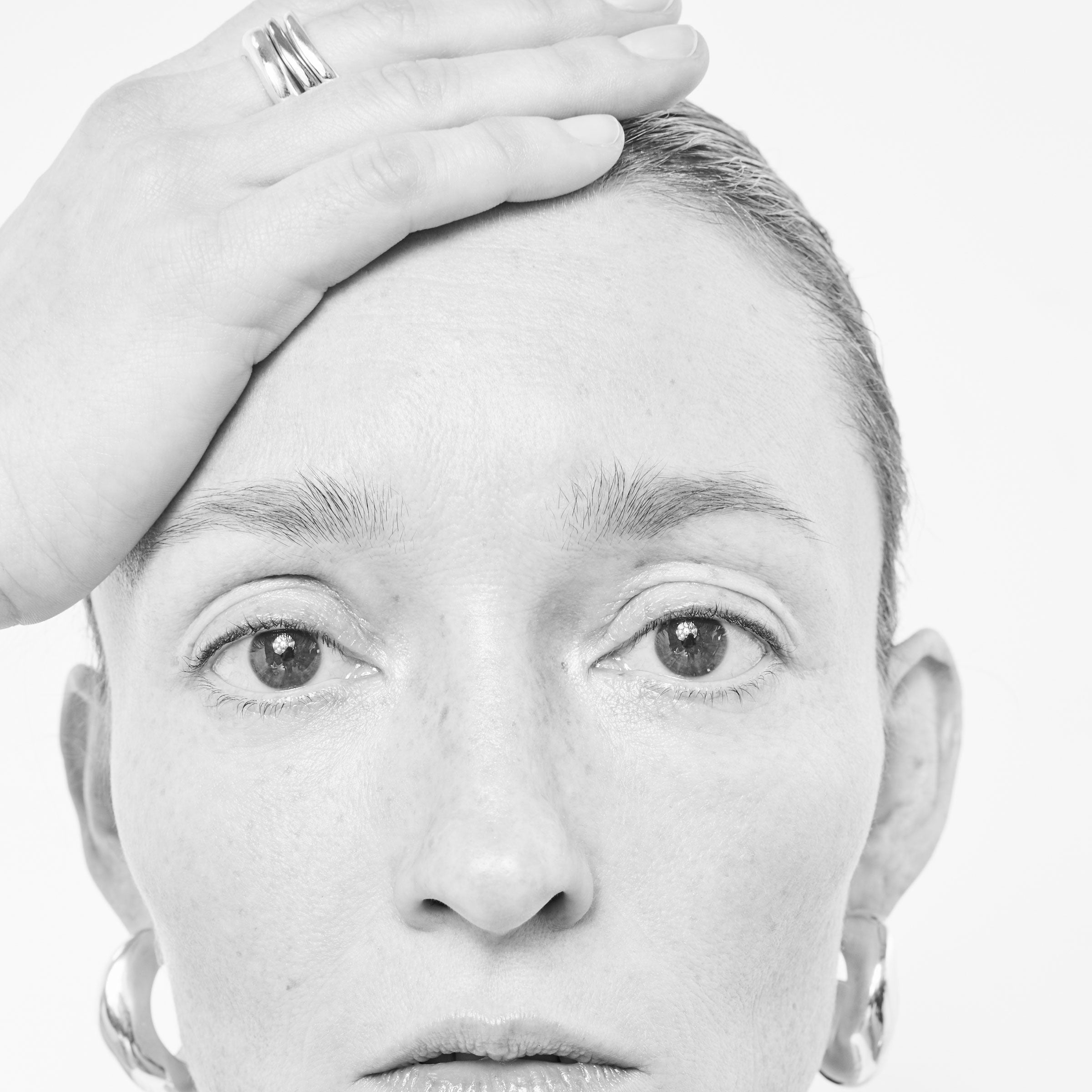 Person wearing AGMES Astrid Ring Set III in .925 Sterling Silver, and 14k Solid Yellow Gold. Includes 2 medium, and 1 large Astrid Ring.