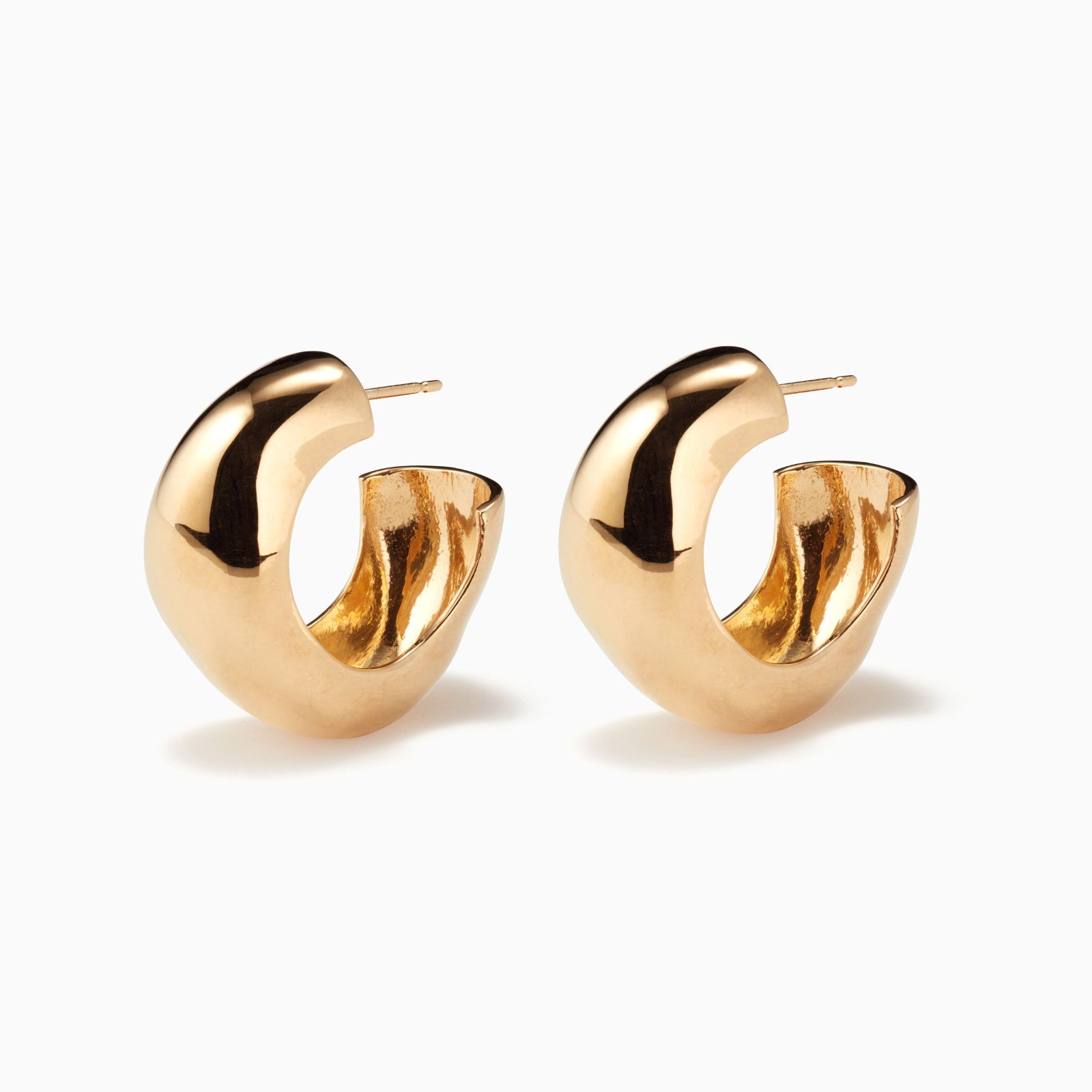 AGMES 14k gold vermeil round sculptural Large Celia Hoops on white background.