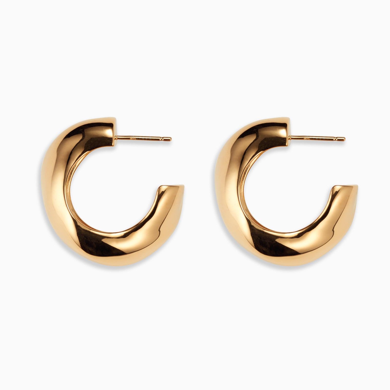 AGMES 14k gold vermeil round sculptural Large Celia Hoops on white background.