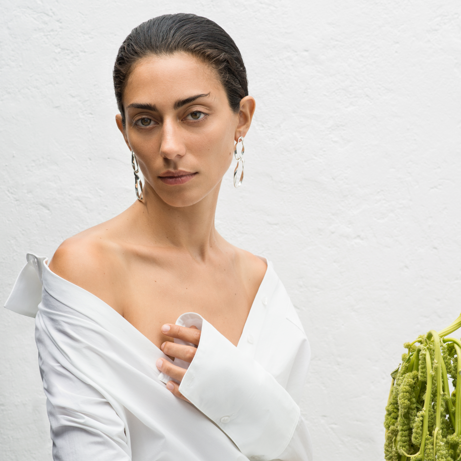 Woman wearing .925 sterling silver AGMES earrings with 2-tiered hoop design
