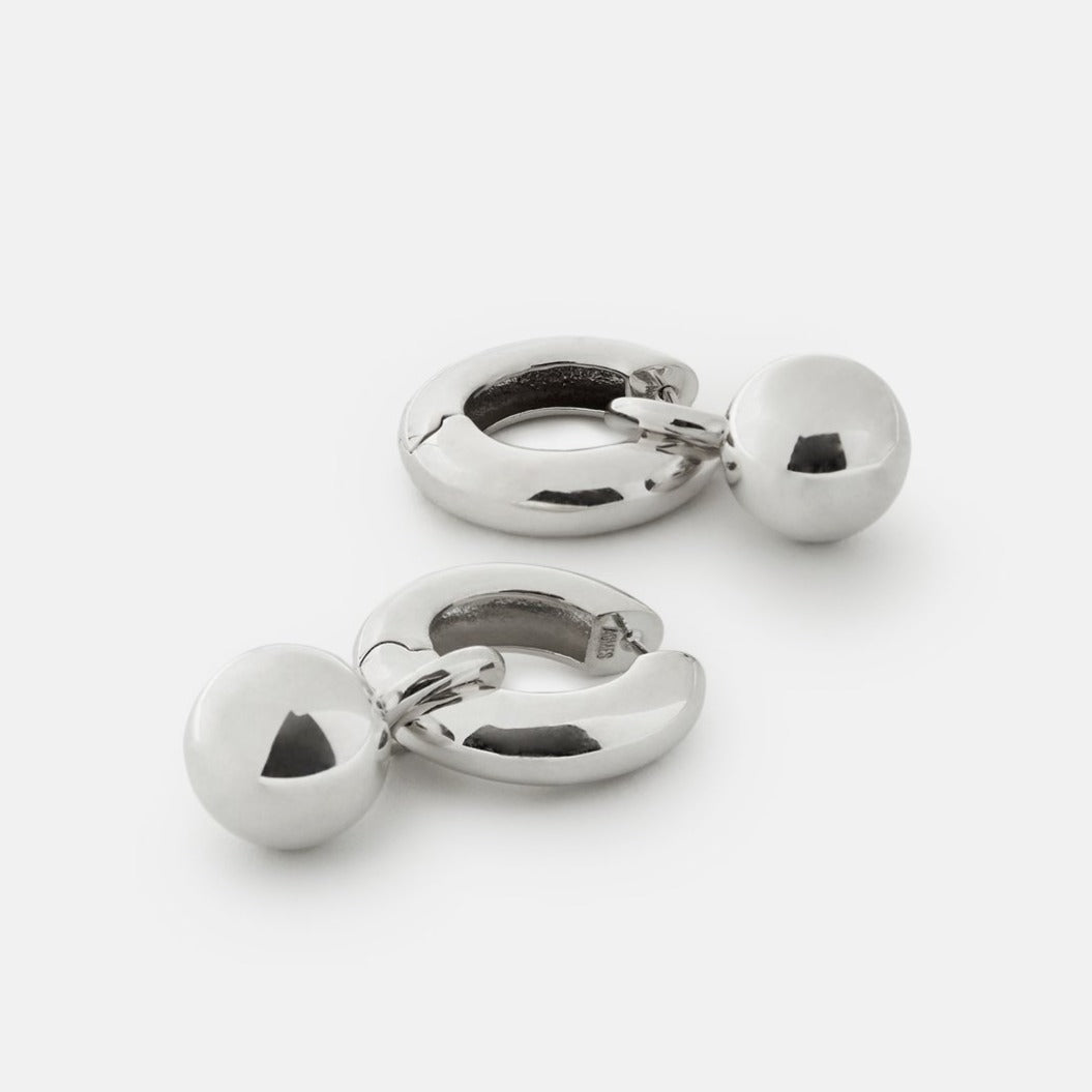 AGMES 0.925 sterling silver Sonia hinged hoop earrings with drop embellishment.