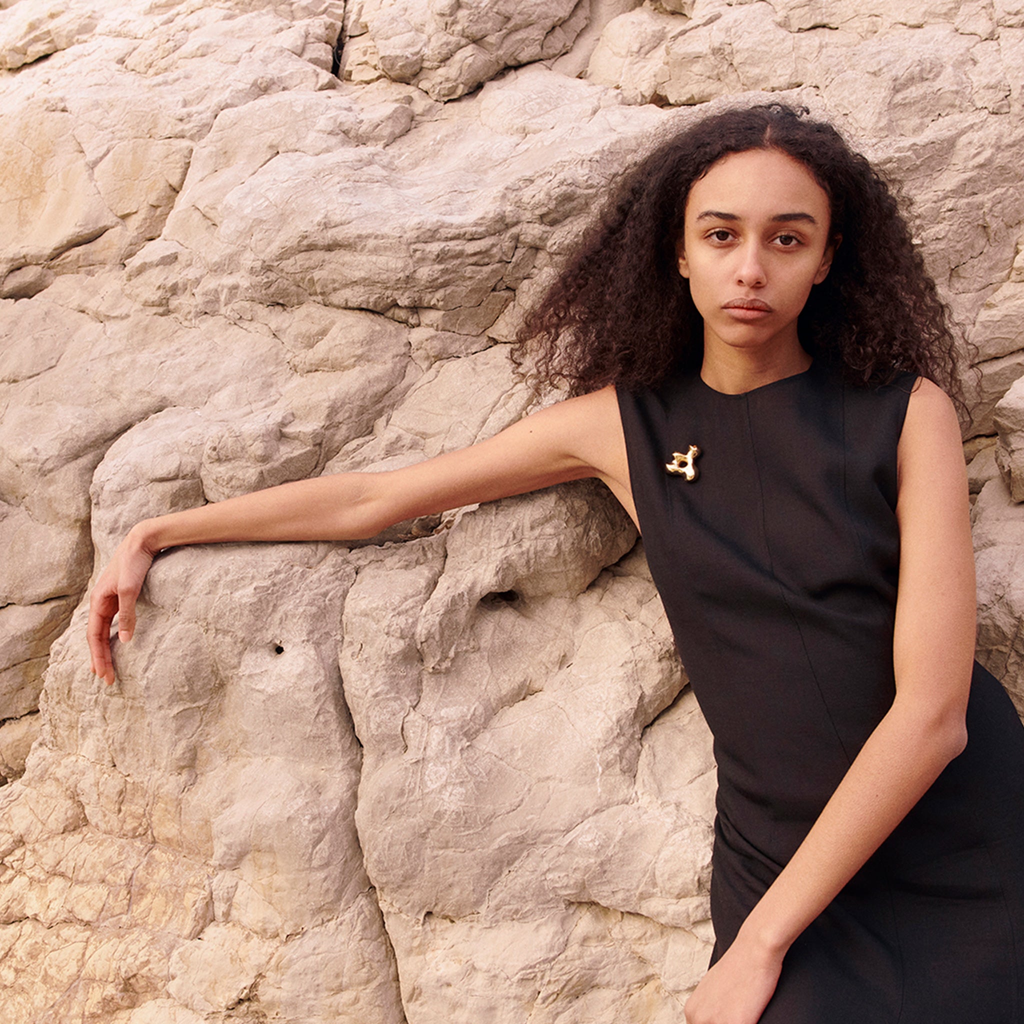 Woman wearing the AGMES 18K Gold Vermeil Simone Brooch. Simone Bodmer-Turner.