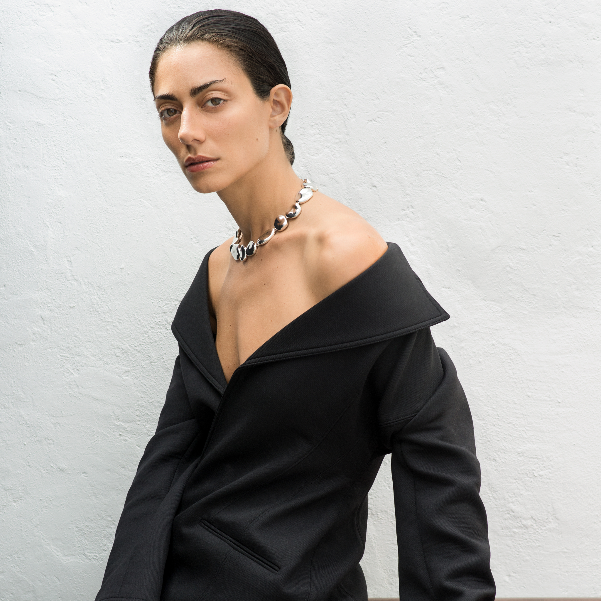 Woman wearing AGMES .925 Sterling Silver Conie sculpted round Necklace with T-Bar Clasp.