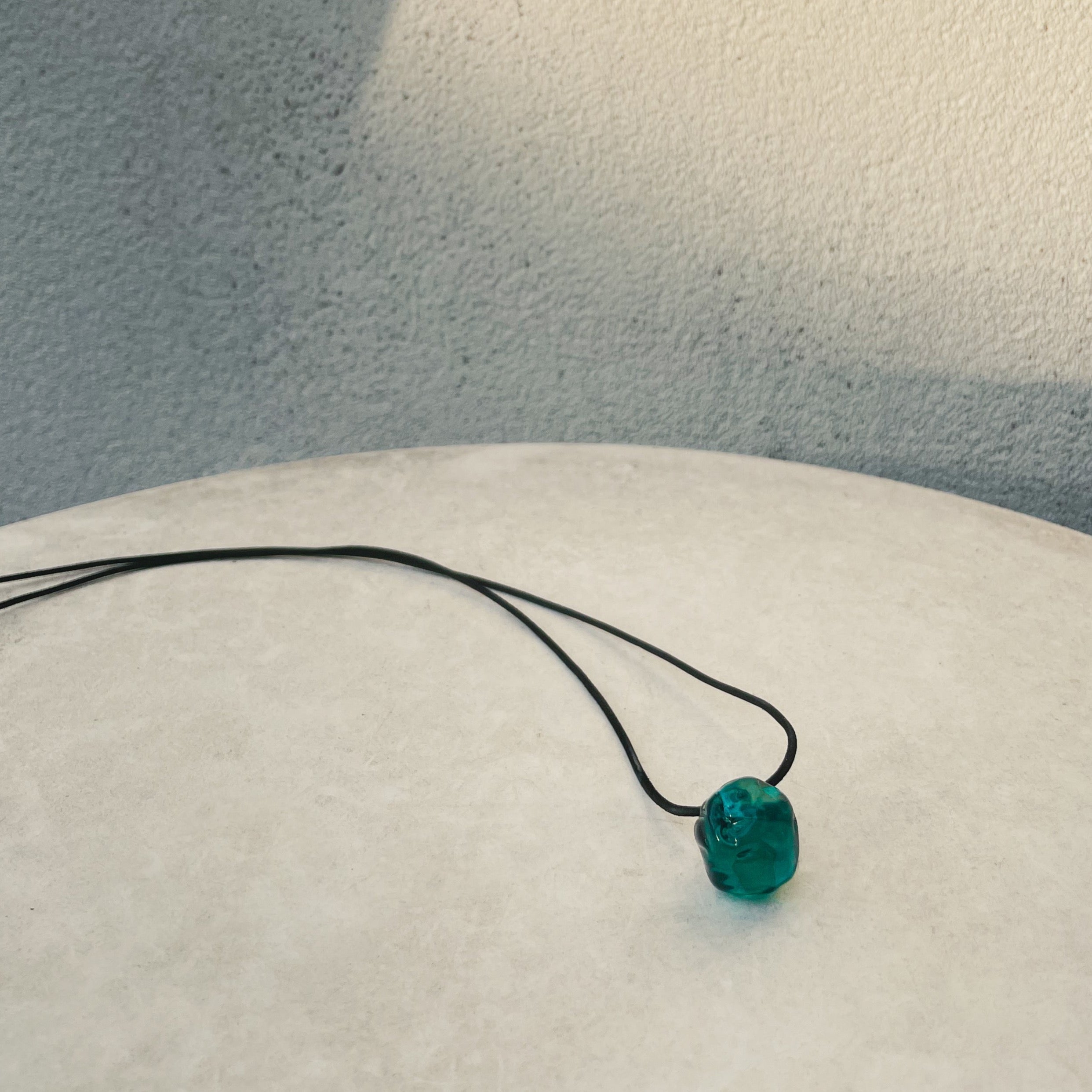 AGMES Rio Pendant Soda Lime Green Glass Bead on black suede cord