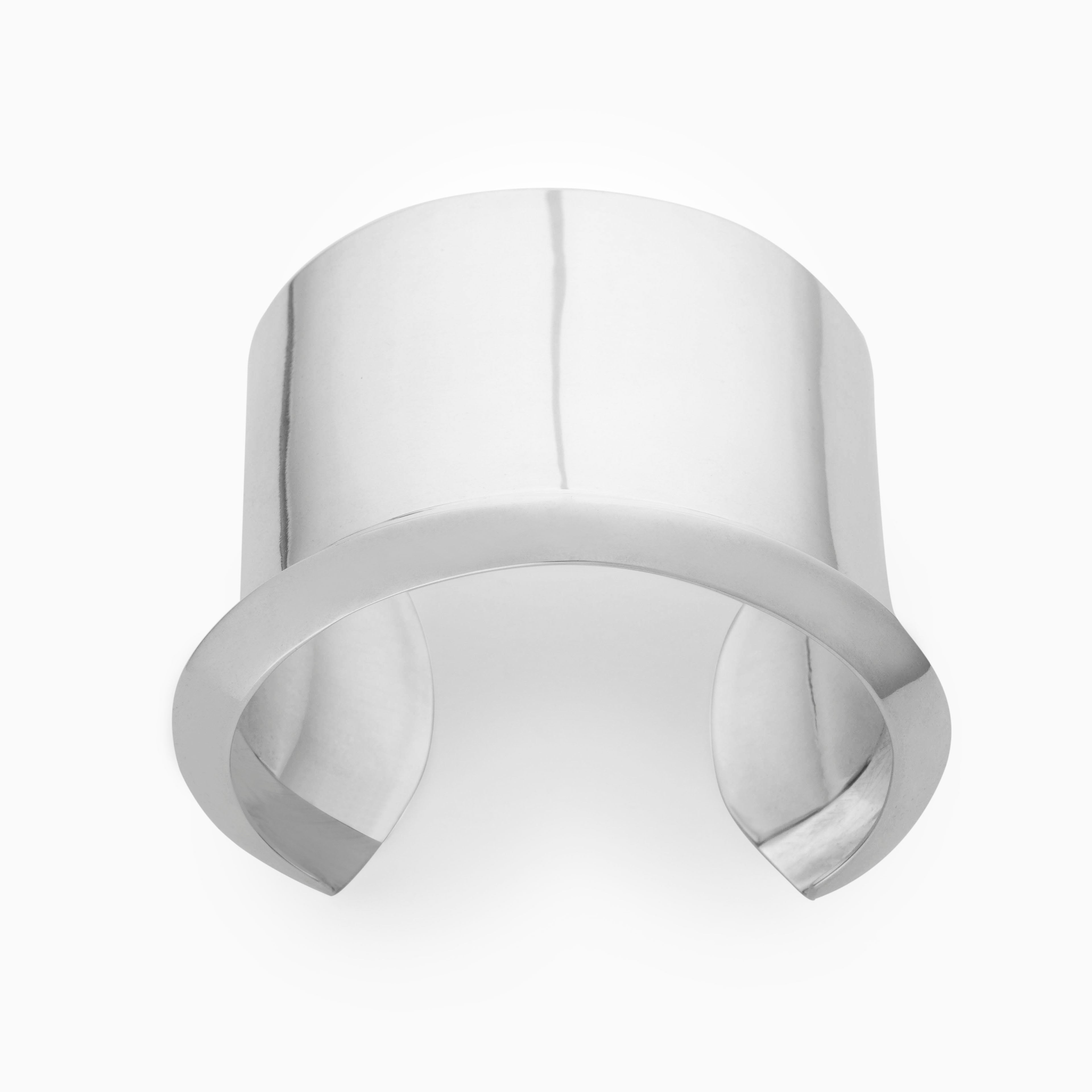 AGMES Cliff_Cuff Simple and modern cuff with a geometric scallop detail on one edge. Measures 1-7/8" wide, sterling silver.