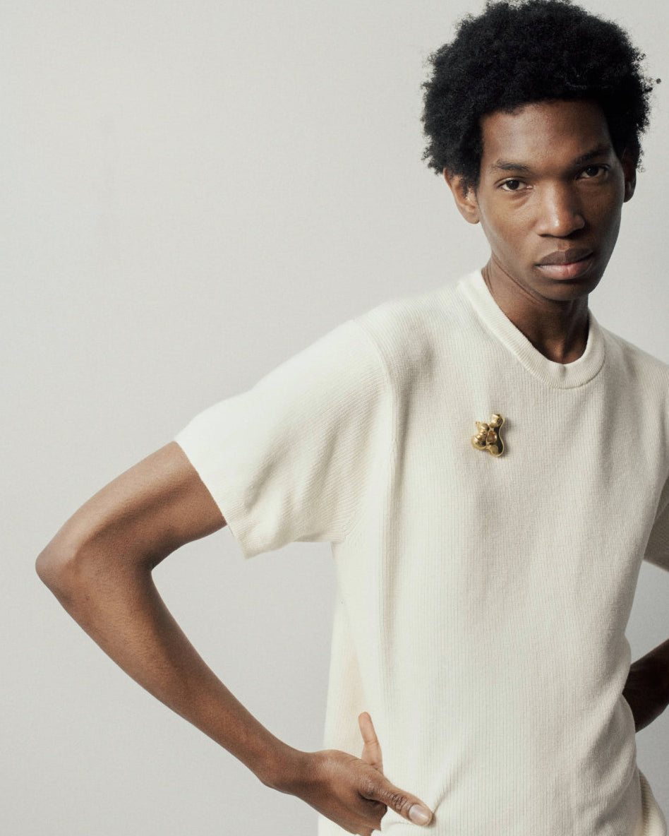 Man wearing the AGMES 18K Gold Vermeil Simone Brooch. Simone Bodmer-Turner. 