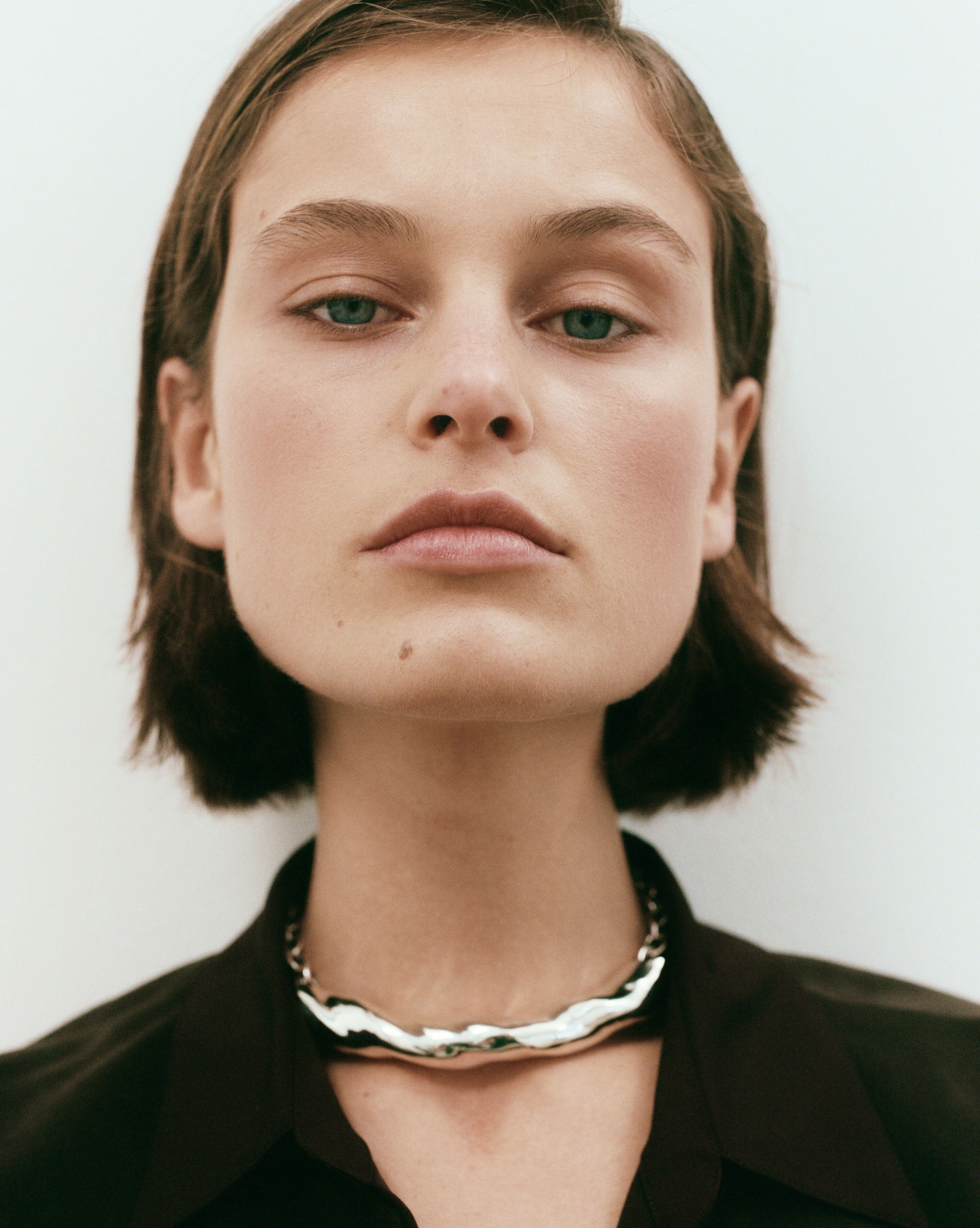 Woman wearing AGMES 0.925 sterling silver sculptural Astrid Choker 