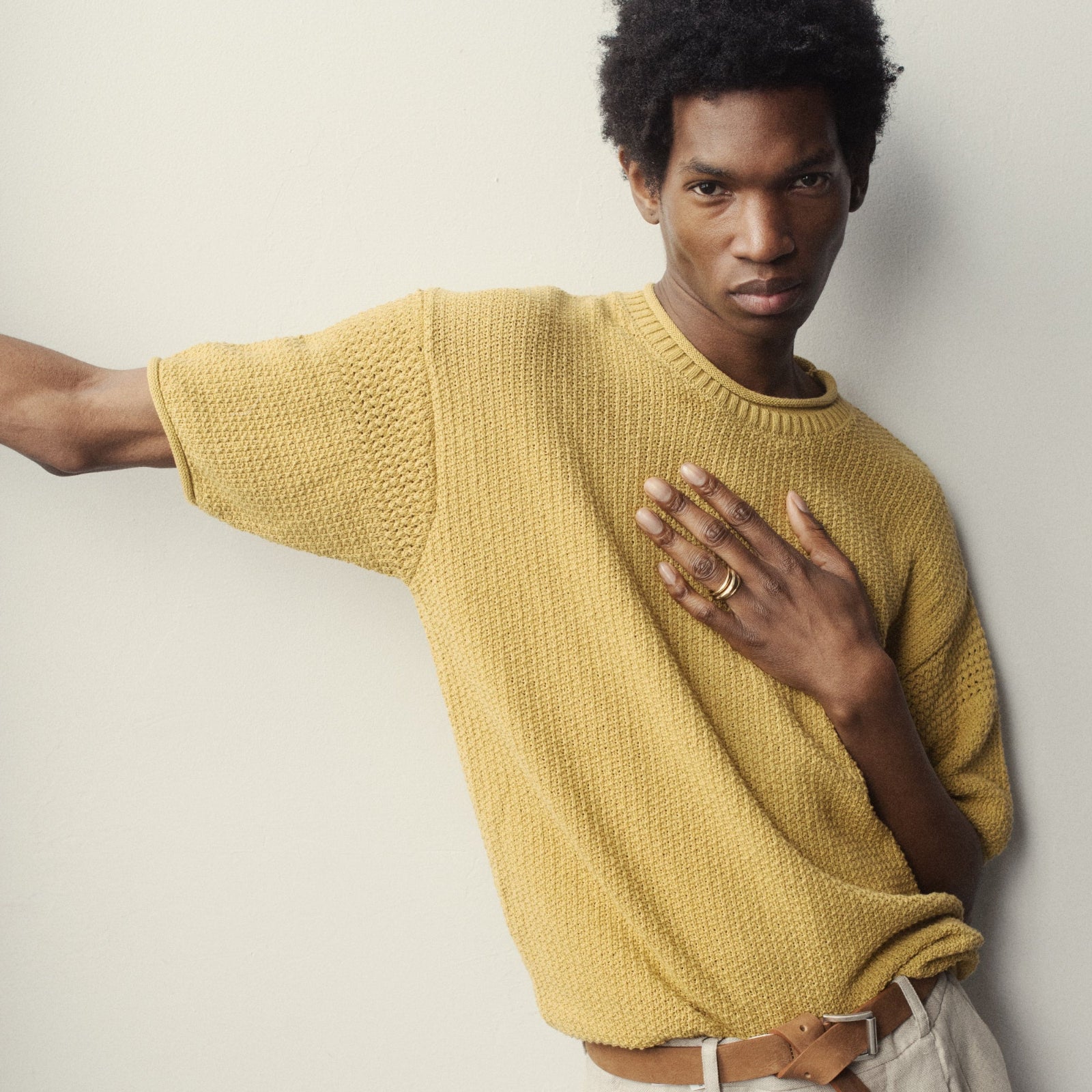 Man wearing AGMES Astrid Rings. 