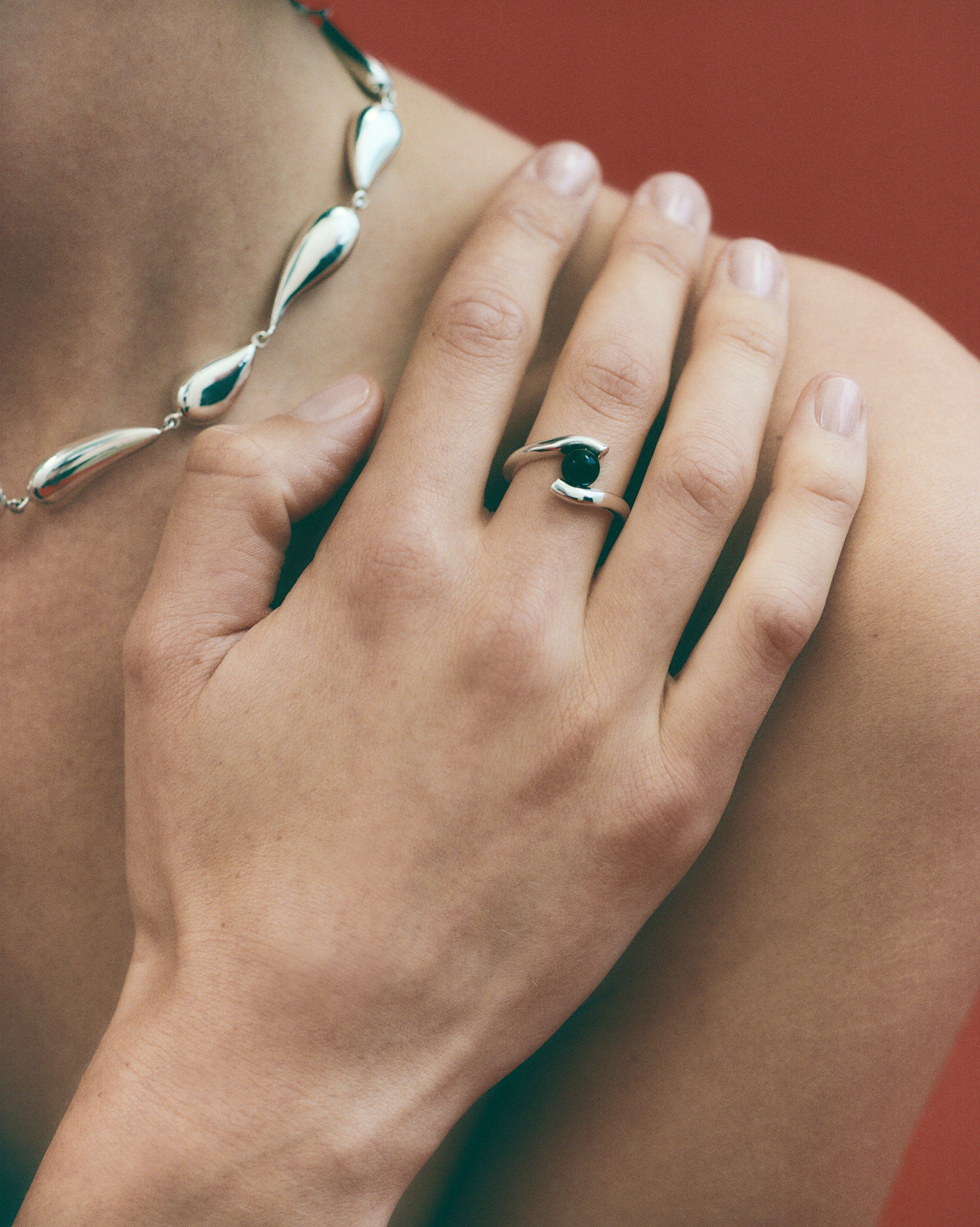 AGMES .925 Sterling Silver Claire Ring with Onyx Stone Center illustrated on hand. 