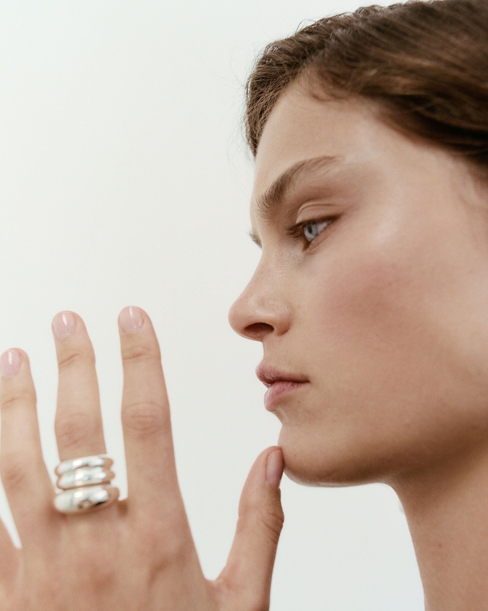 Woman wearing the AGMES .925 Sterling Silver Domed Ridge Ring Set. 