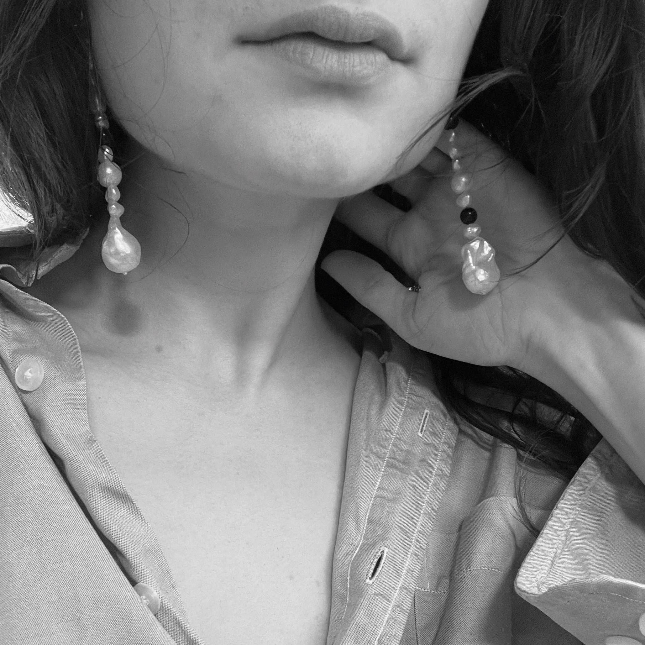 Woman wearing AGMES .925 Sterling Silver Long Kait Earrings with Baroque Pearl and Lapis Stone. 