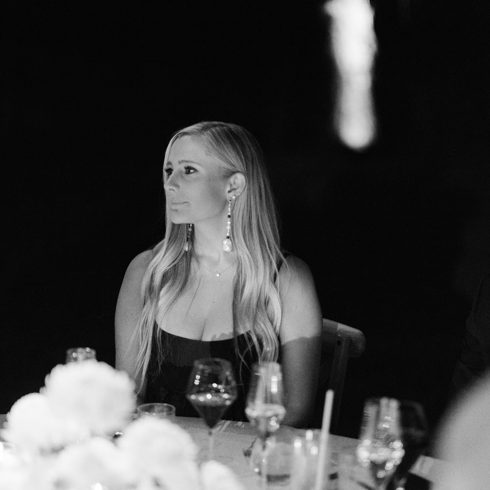 Woman wearing AGMES 18K Gold Vermeil Long Kait Earrings with Baroque Pearl and Lapis Stone. 