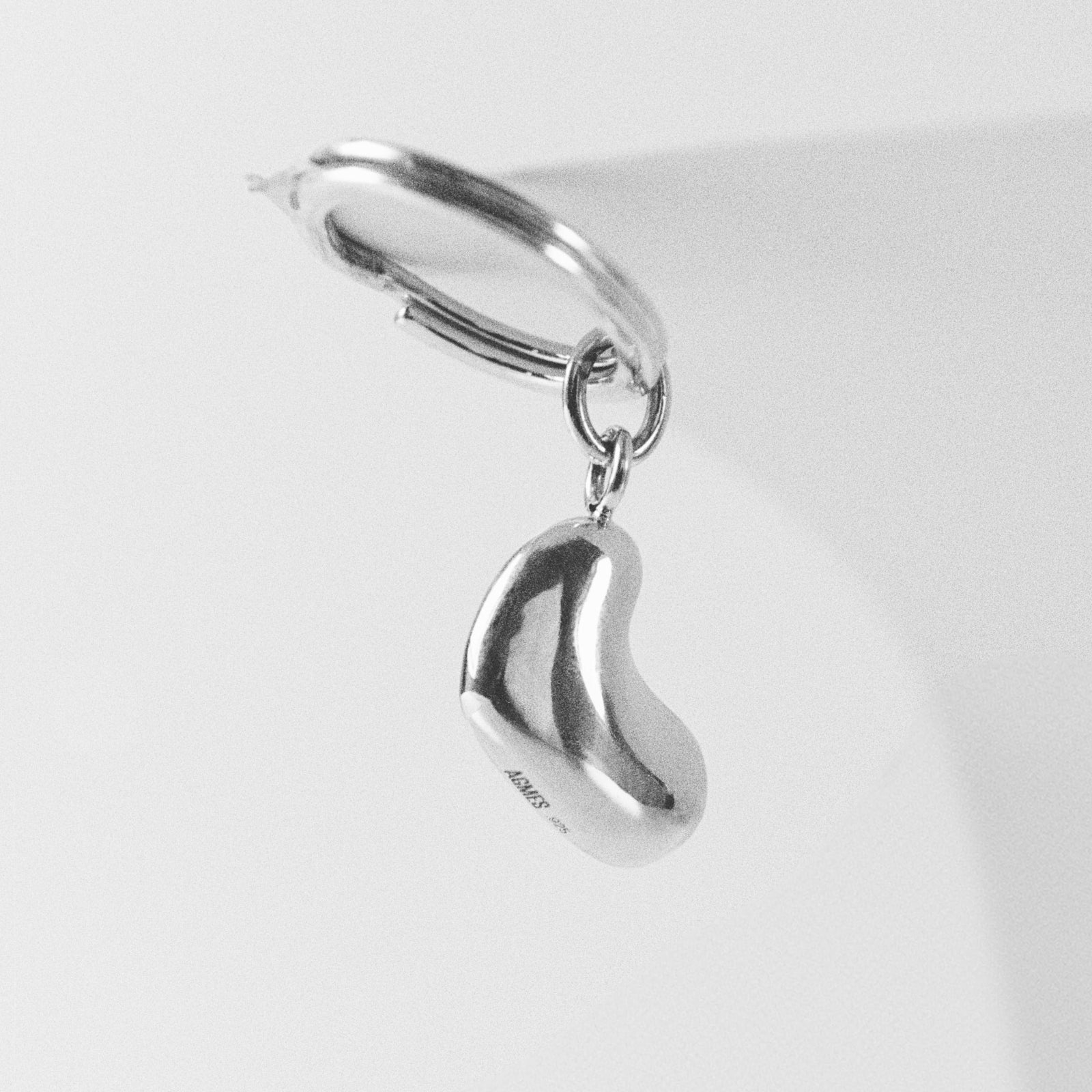 AGMES .925 sterling silver Small Sculpted Heart Keychain on white background.
