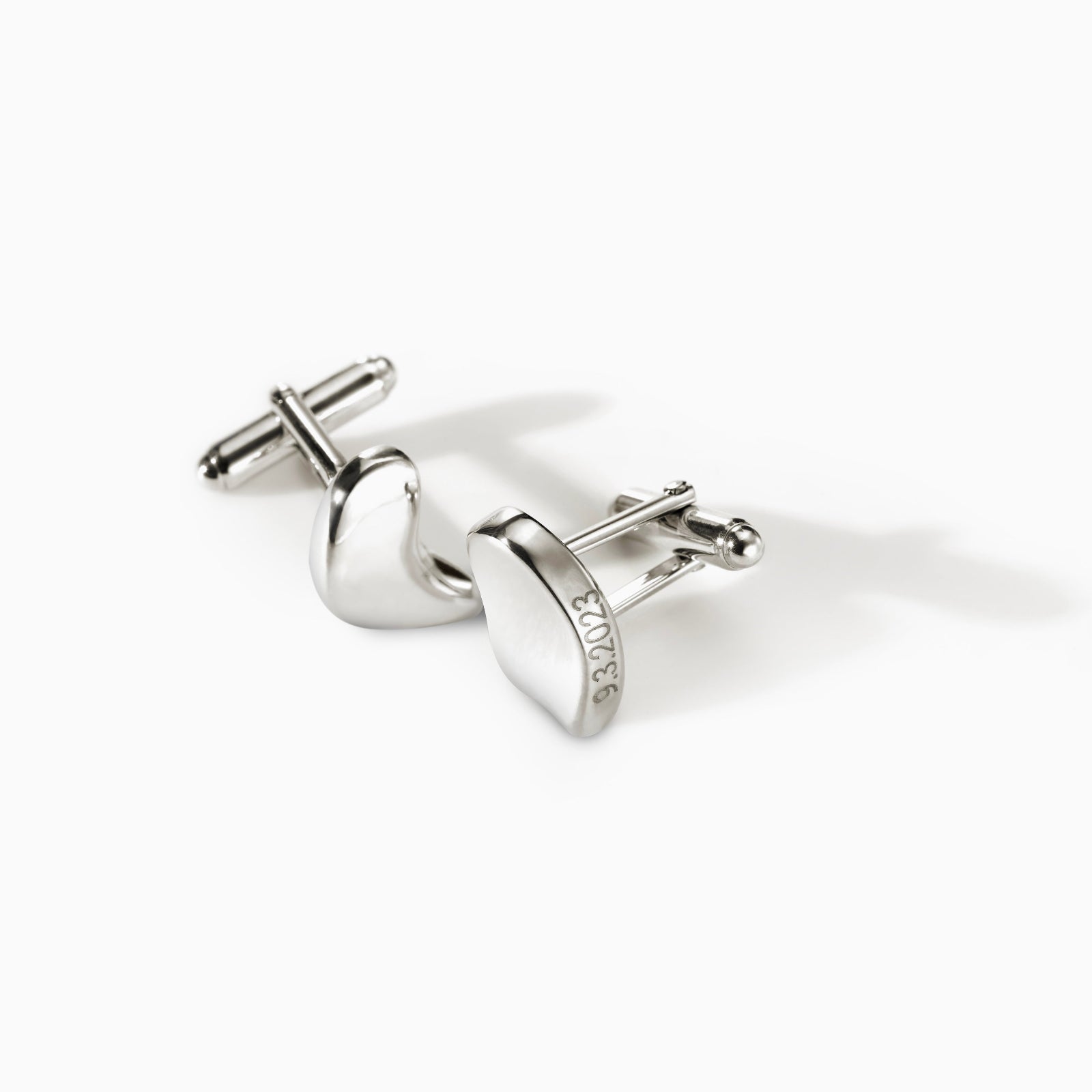 AGMES .925 sterling silver sculptural heart Sum of Parts cufflinks on white background.