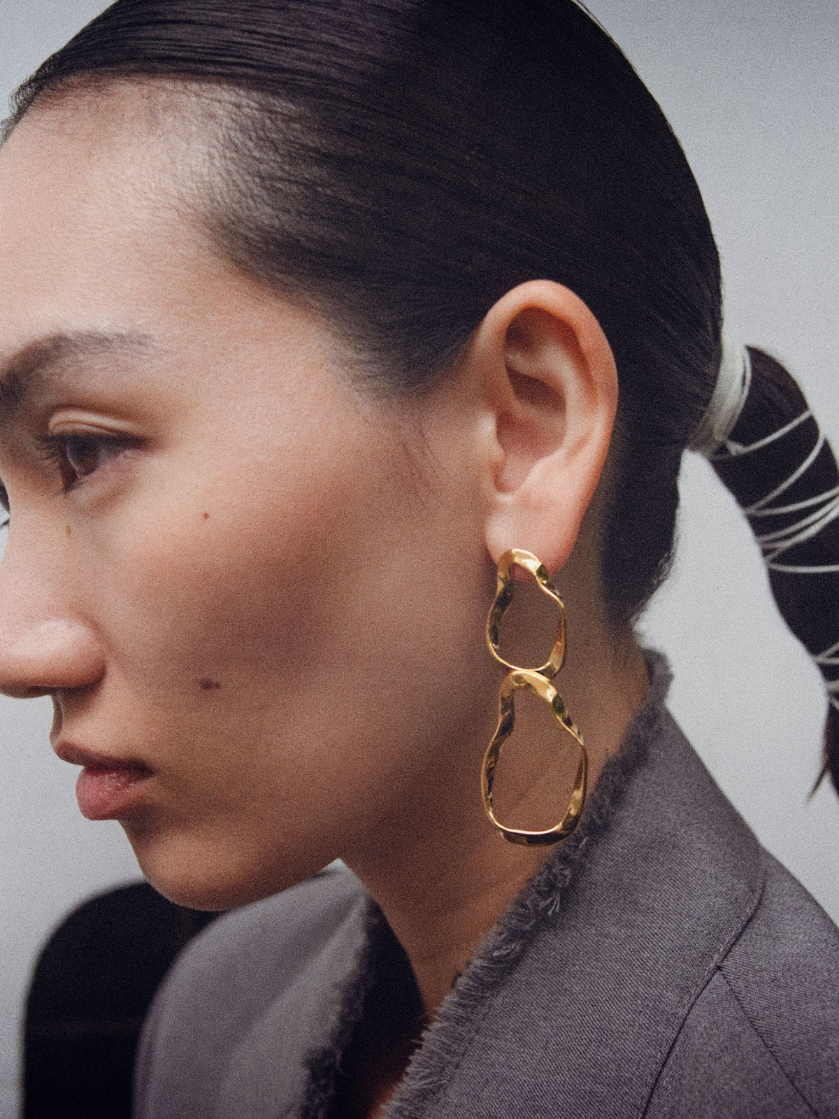 Woman wearing AGMES 18k gold vermeil Viviane Earrings with double hoop design