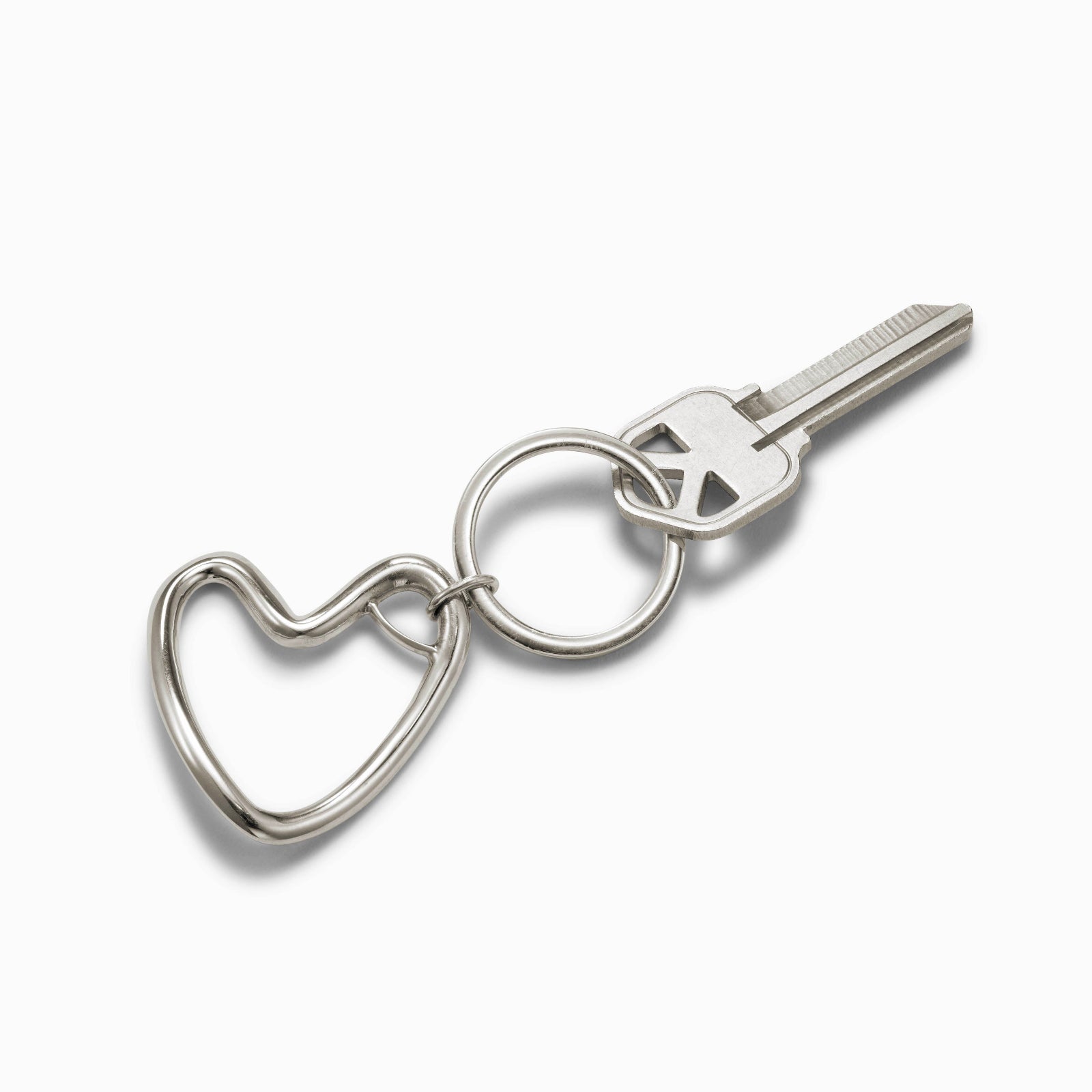 AGMES .925 sterling silver sculptural heart Altun Keychain on white background.