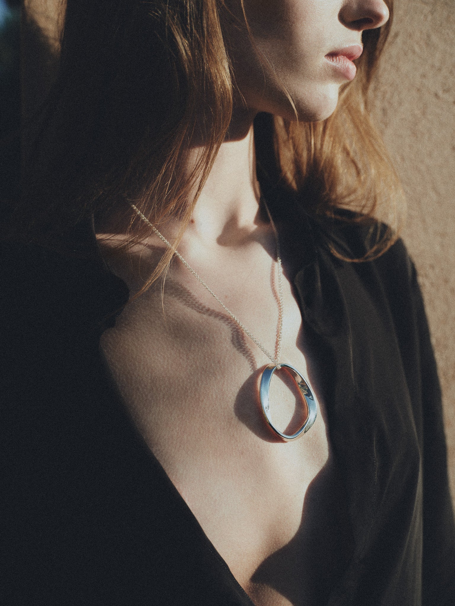 Woman wearing AGMES 925 sterling silver Isabel Pendant 