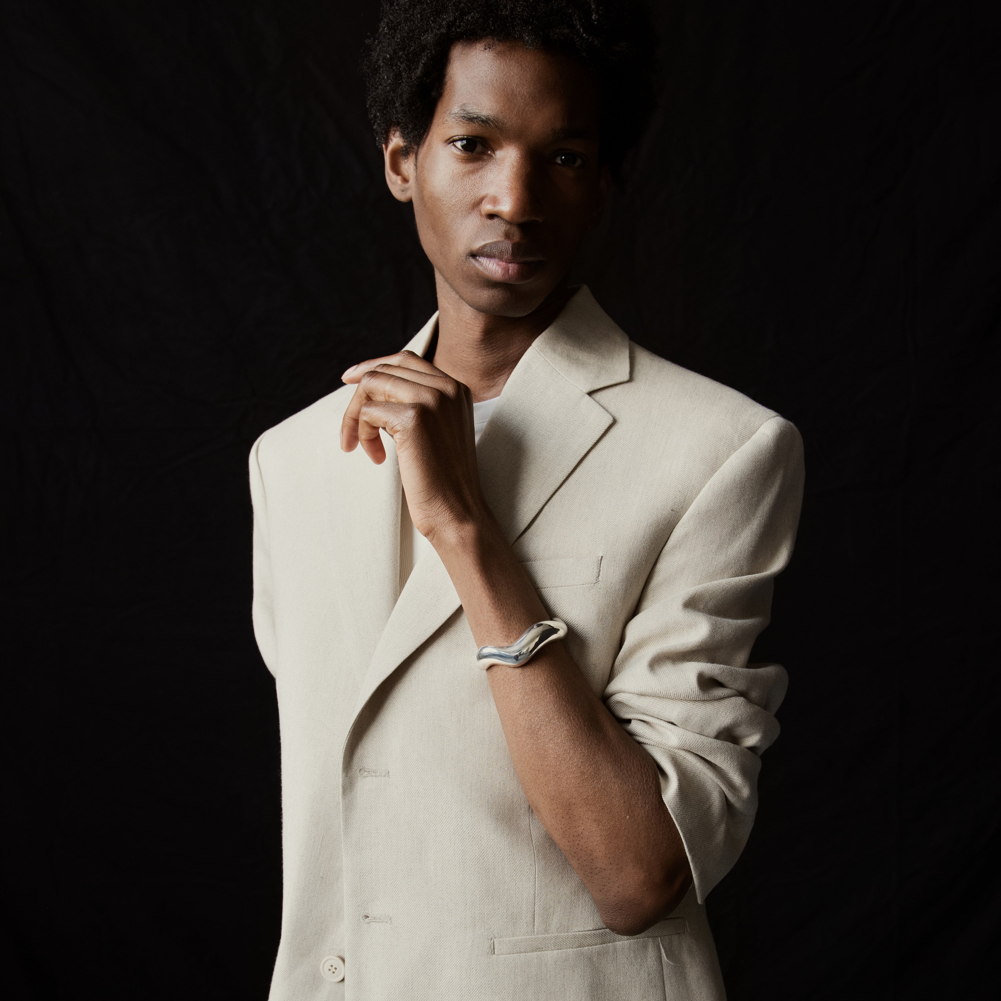 Person wearing AGMES 0.925 sterling silver large Astrid sculpted cuff bracelet.