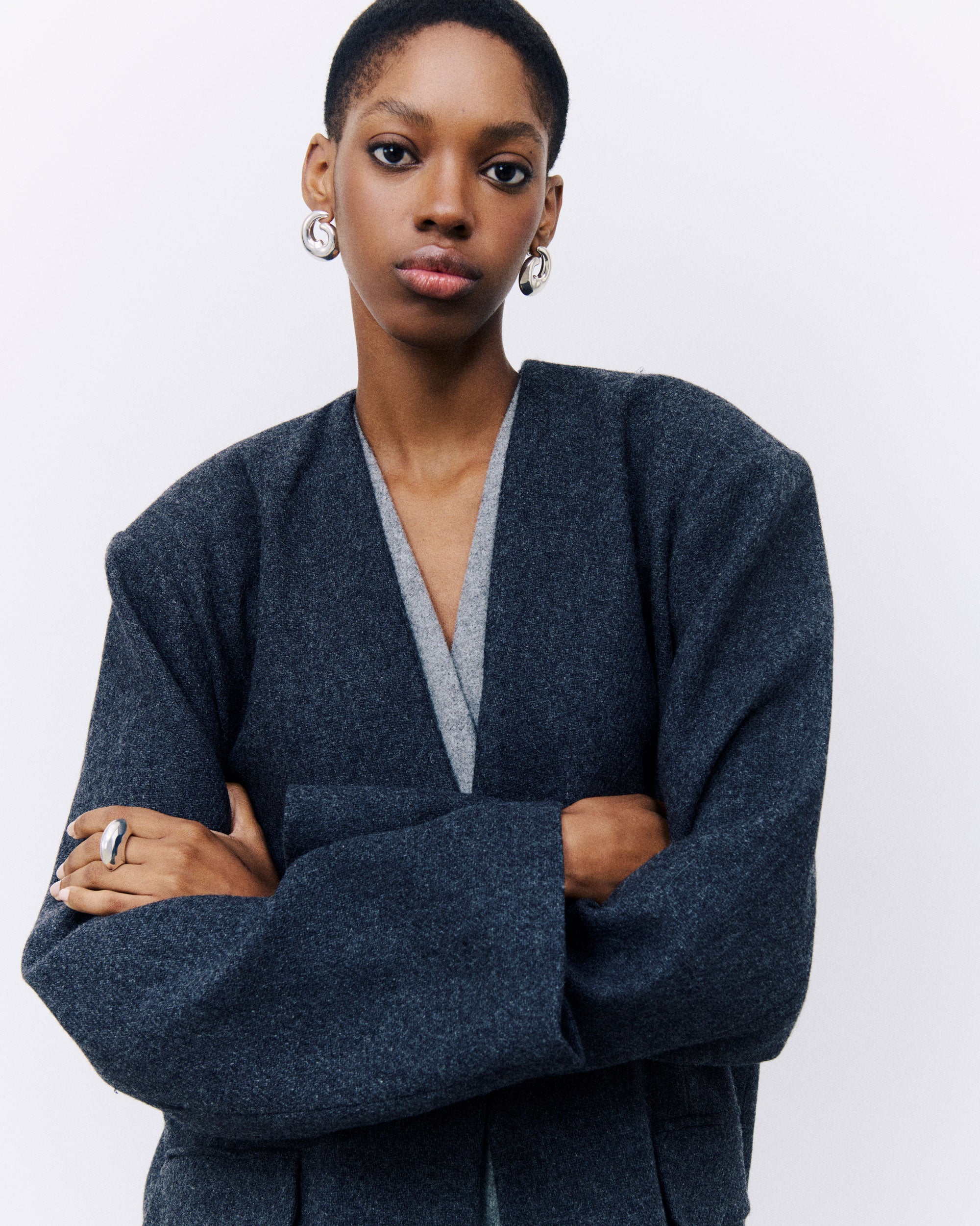 Model wearing AGMES .925 sterling silver Nadia Earrings and Jouve Ring