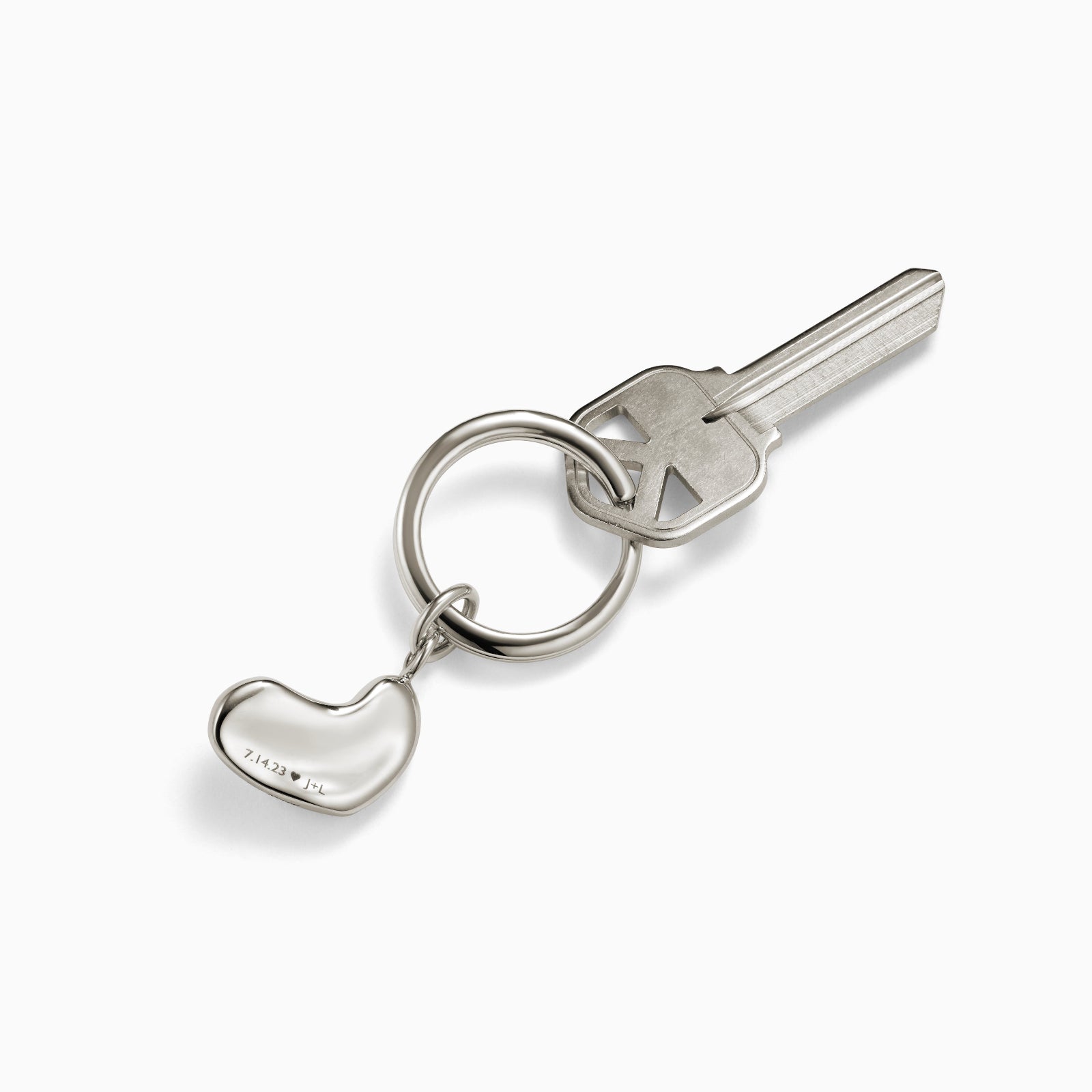 AGMES .925 sterling silver Small Sculpted Heart Keychain on white background.