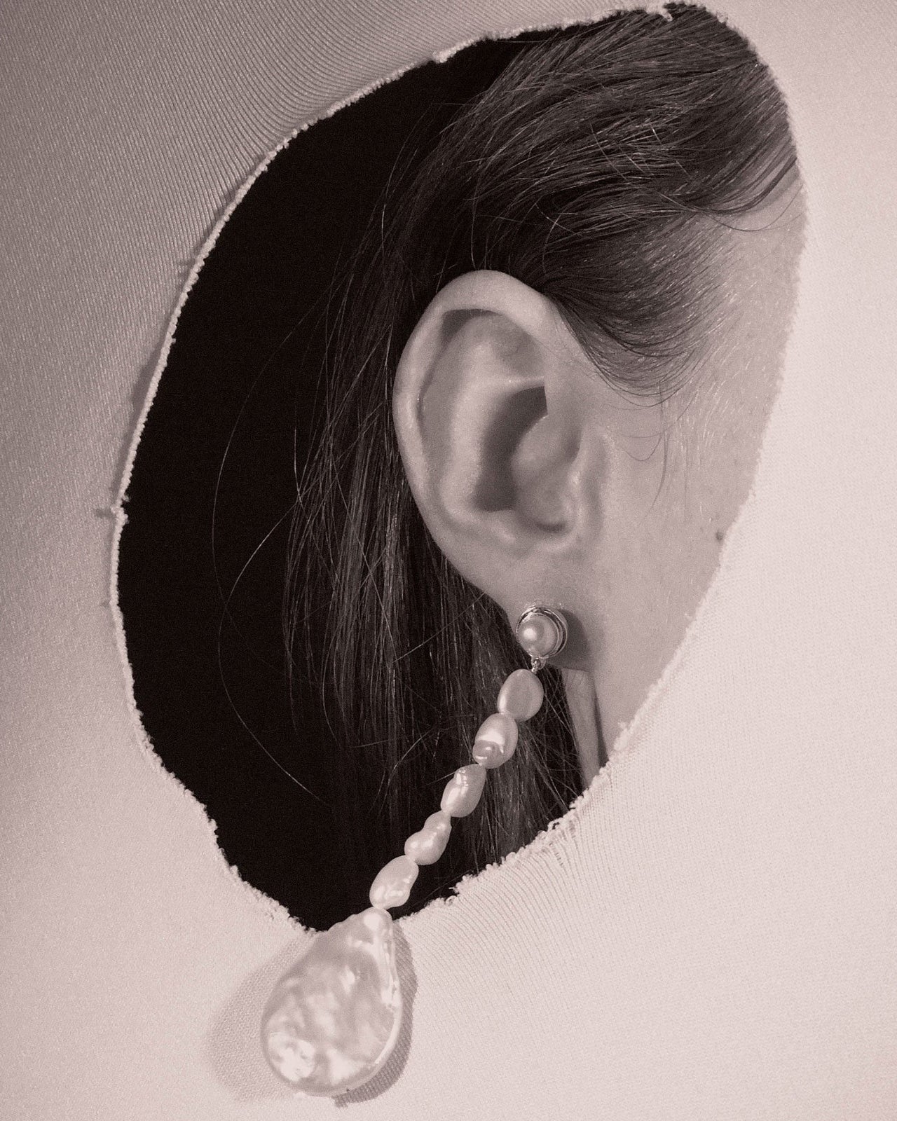 Woman wearing AGMES Emmanuelle earrings in 0.925 sterling silver with freshwater pearls.