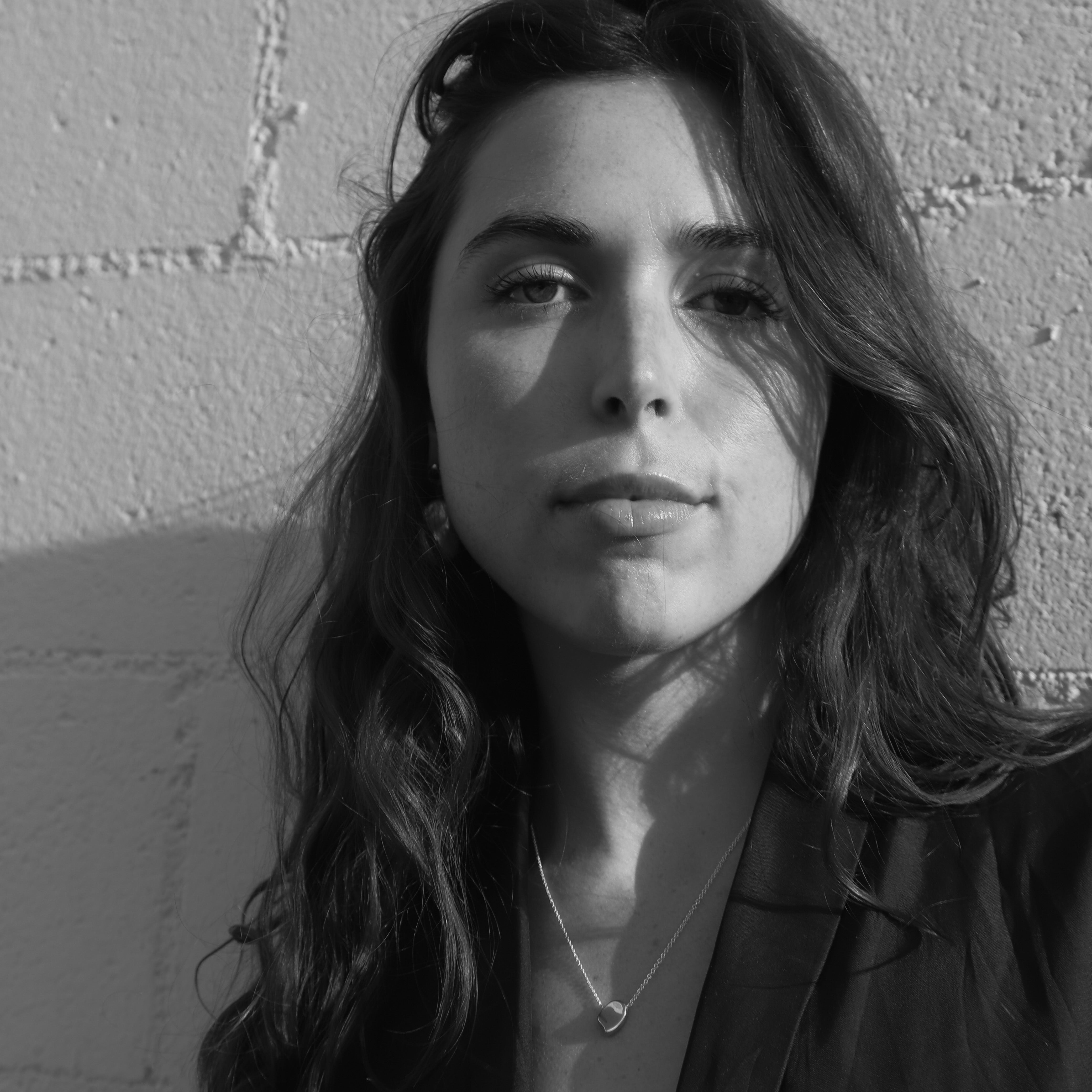 Woman wearing the AGMES .925 Sterling Silver Sum of Parts Pendant. 