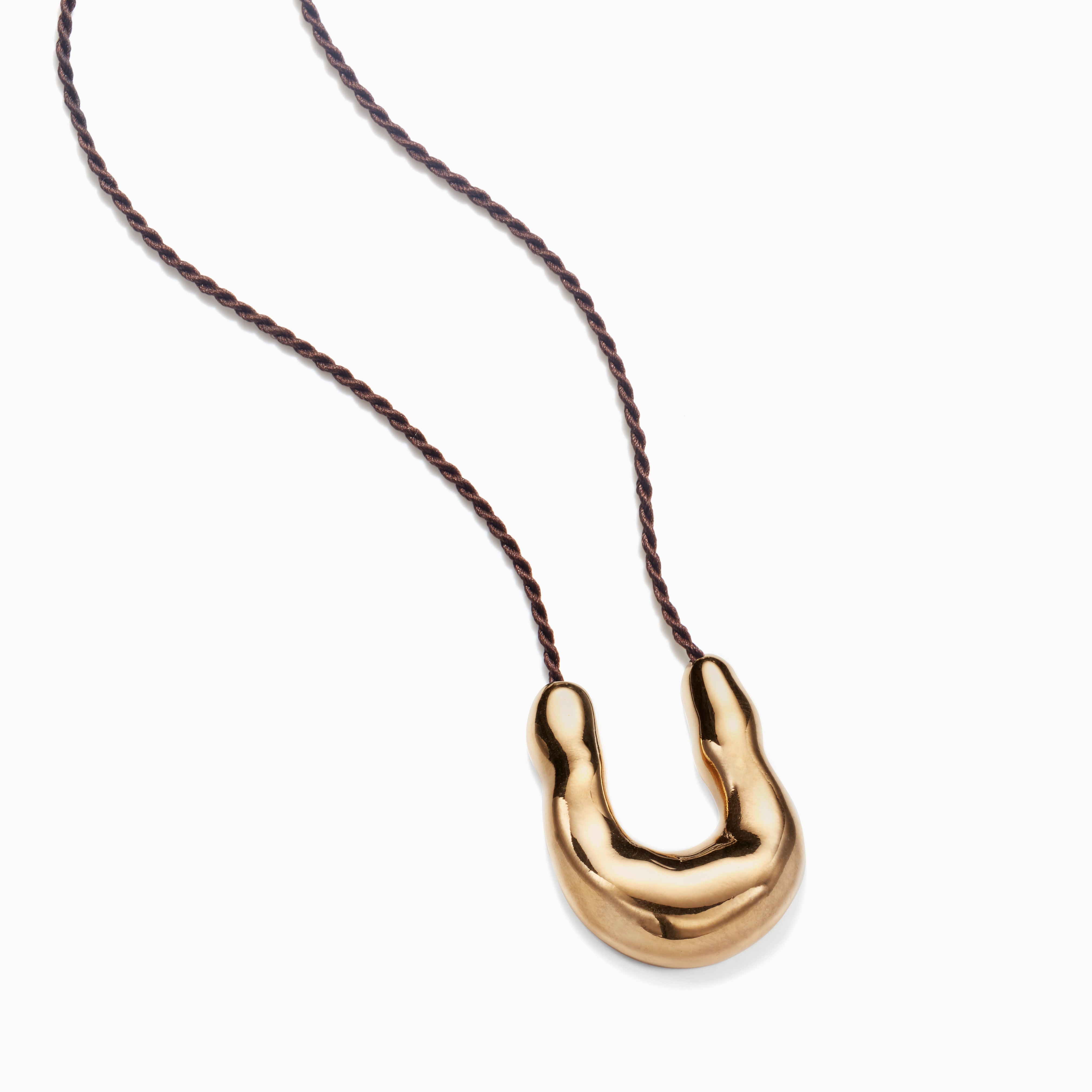 AGMES 18k Gold Vermeil Wishbone Pendant on Chocolate Silk Cord on white background.