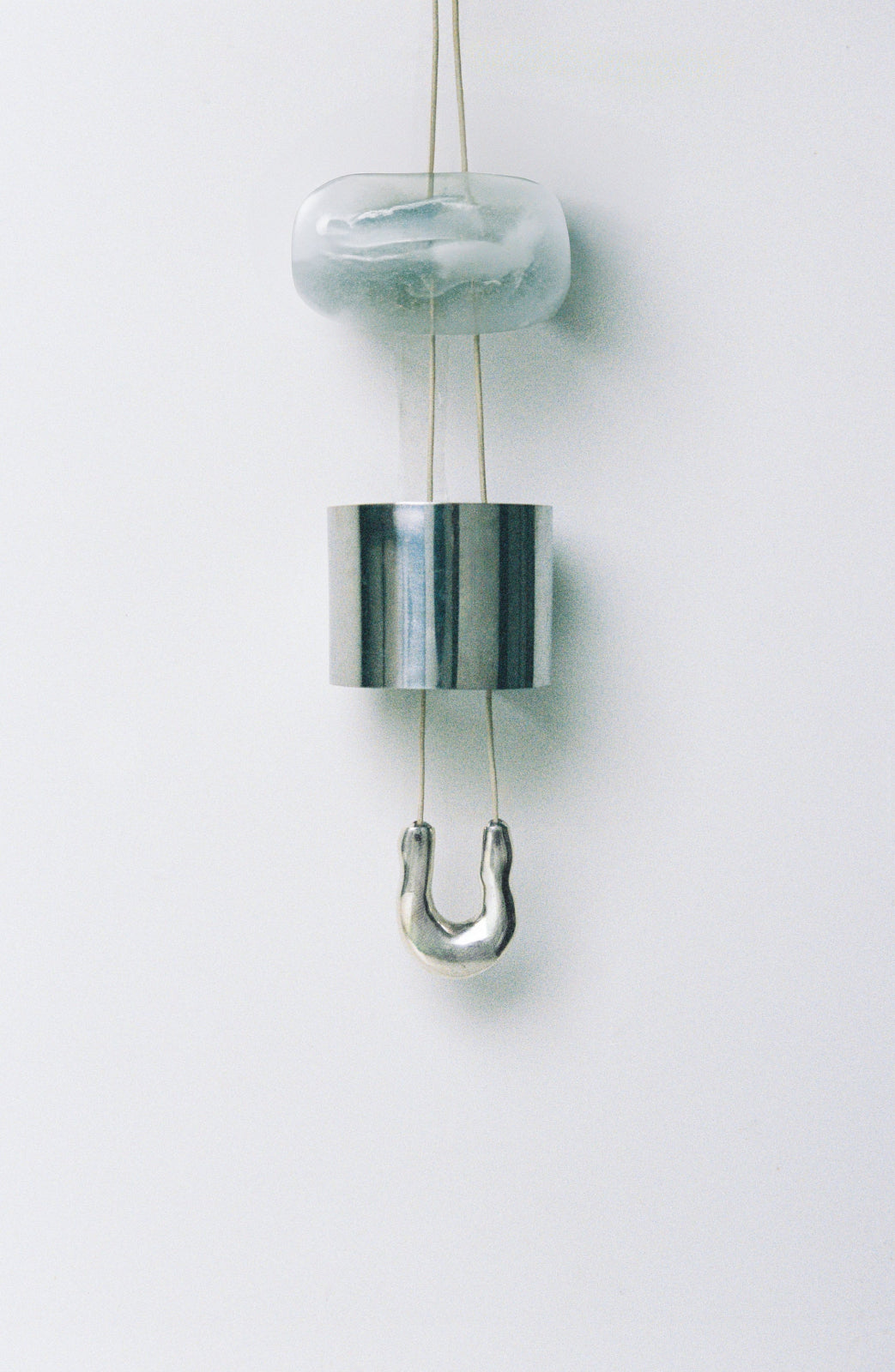 AGMES .925 sterling silver wishbone pendant on Ivory Satin cord.