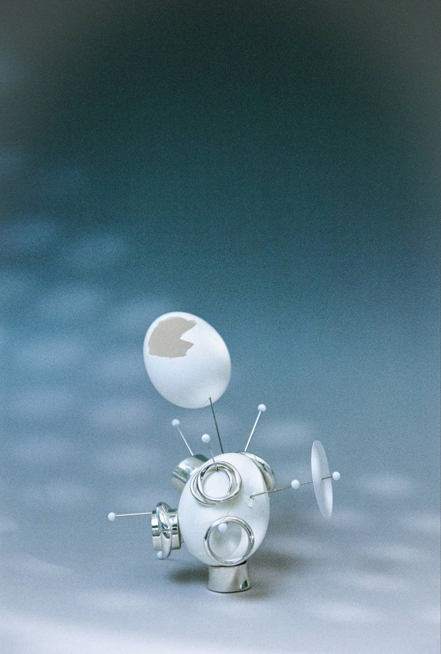 AGMES .925 sterling silver sculptural Arden and Astrid rings. Photographed with eggs on blue background.