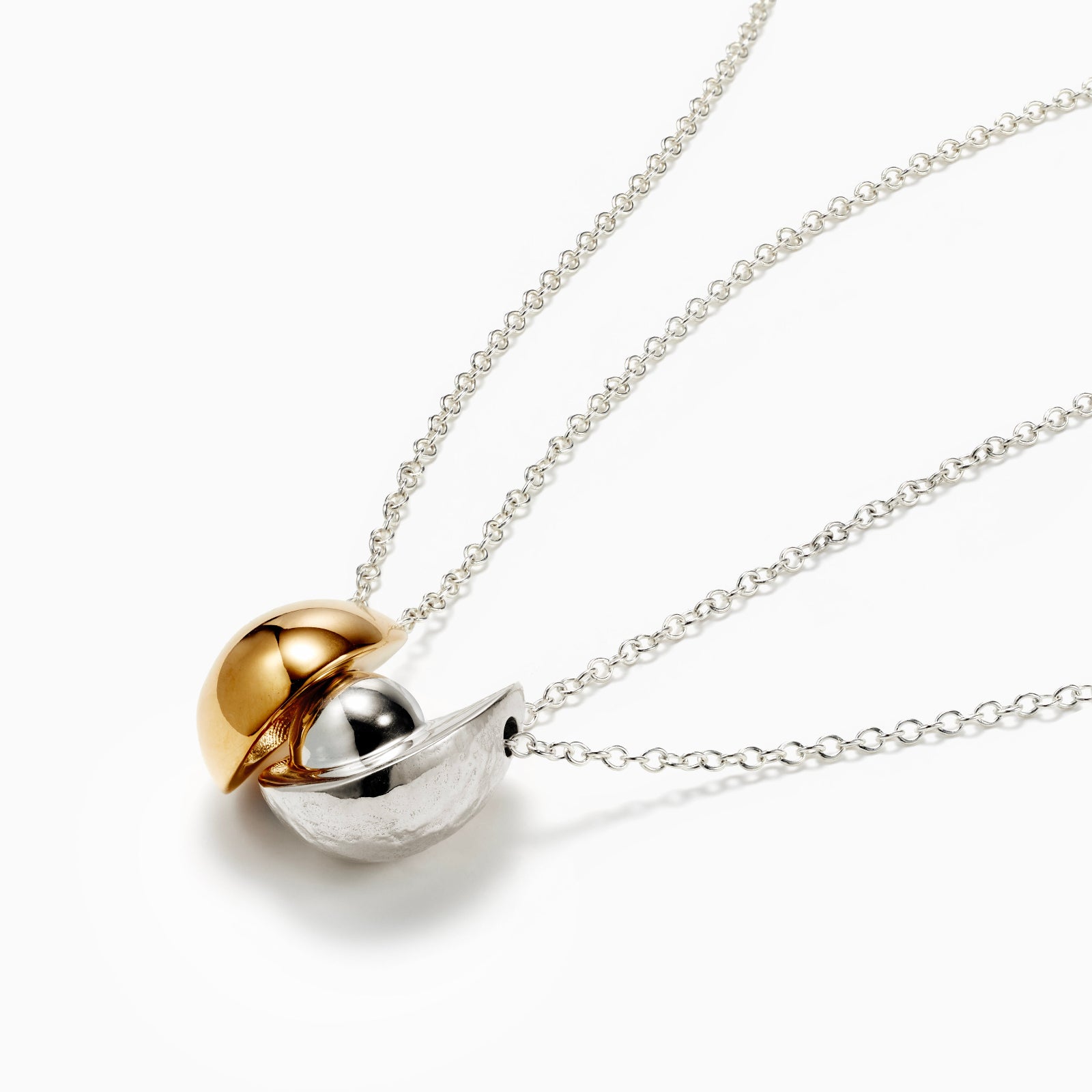 AGMES 0.925 sterling silver avocado and  18k gold vermeil egg necklace on white background.