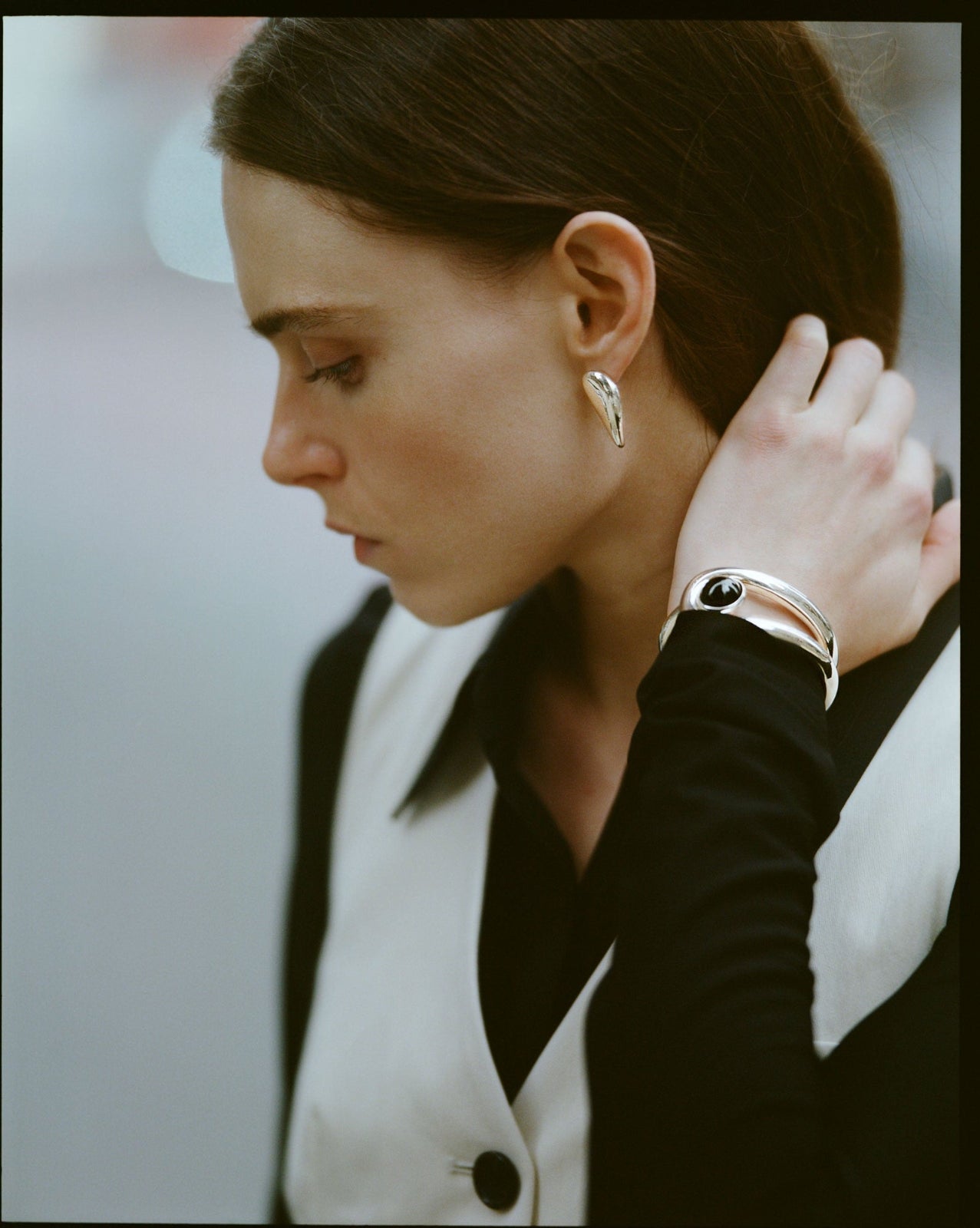 Model wearing .925 sterling silver catherine statement drop earrings with onyx stone becky cuff bracelet