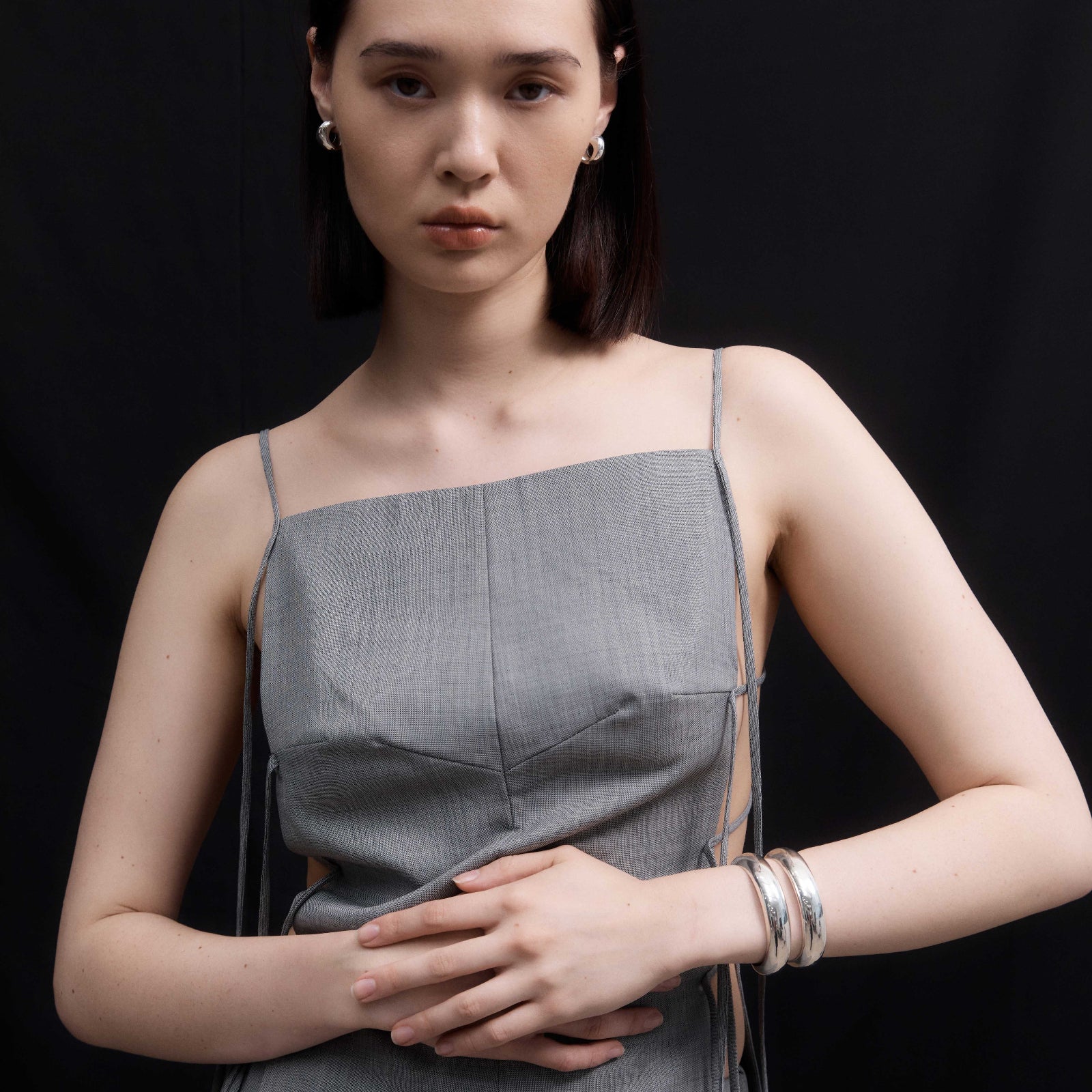 Woman wearing AGMES 0.925 Sterling Silver Charlotte Cuff and Small Celia Earrings