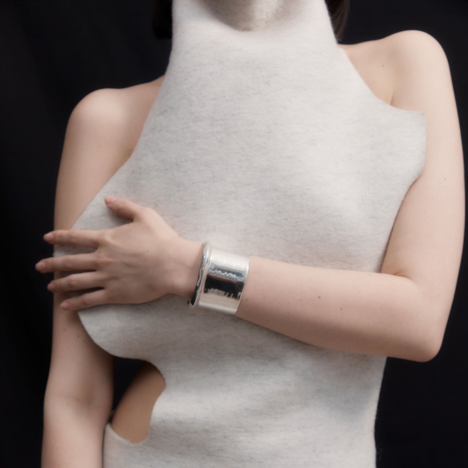 AGMES Cliff_Cuff Simple and modern cuff with a geometric scallop detail on one edge. Measures 1-7/8" wide, sterling silver.