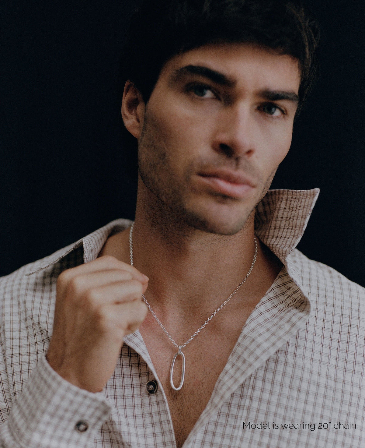 Model wearing AGMES .925 sterling silver 20 inch Devon Chain Necklace with silver link embellishment and checkered shirt.