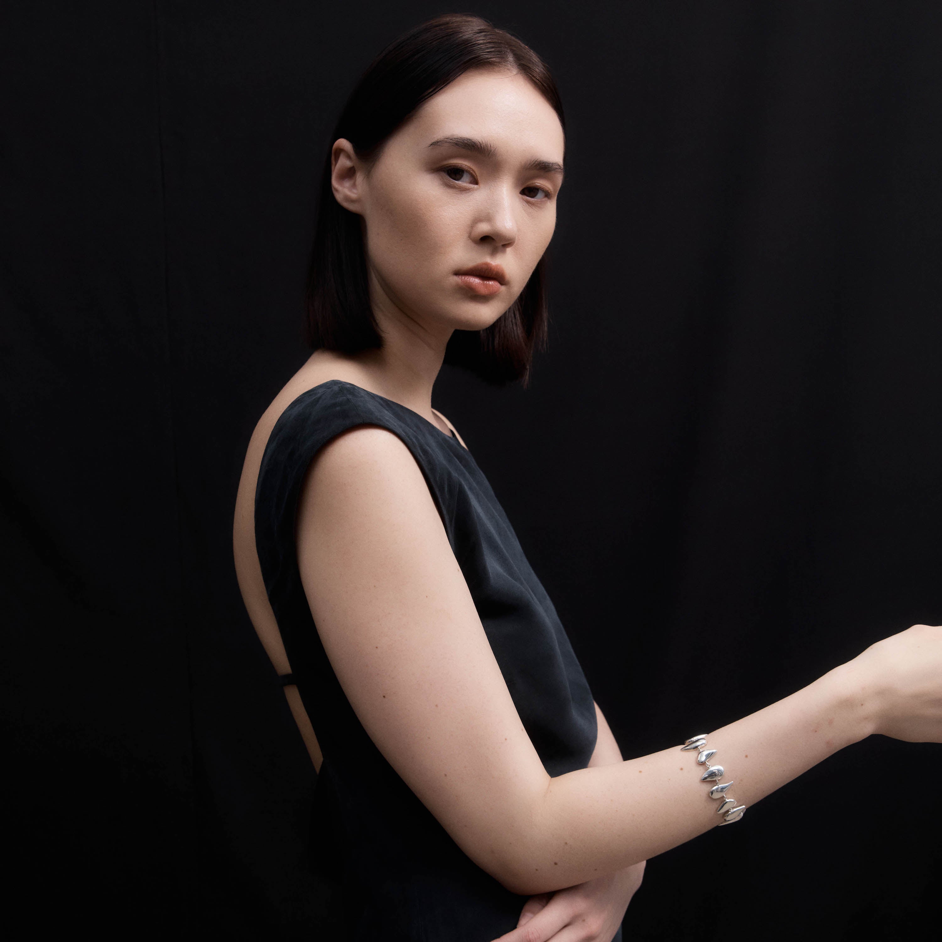 Woman wearing AGMES 0.925 sterling silver Flora Bracelet 