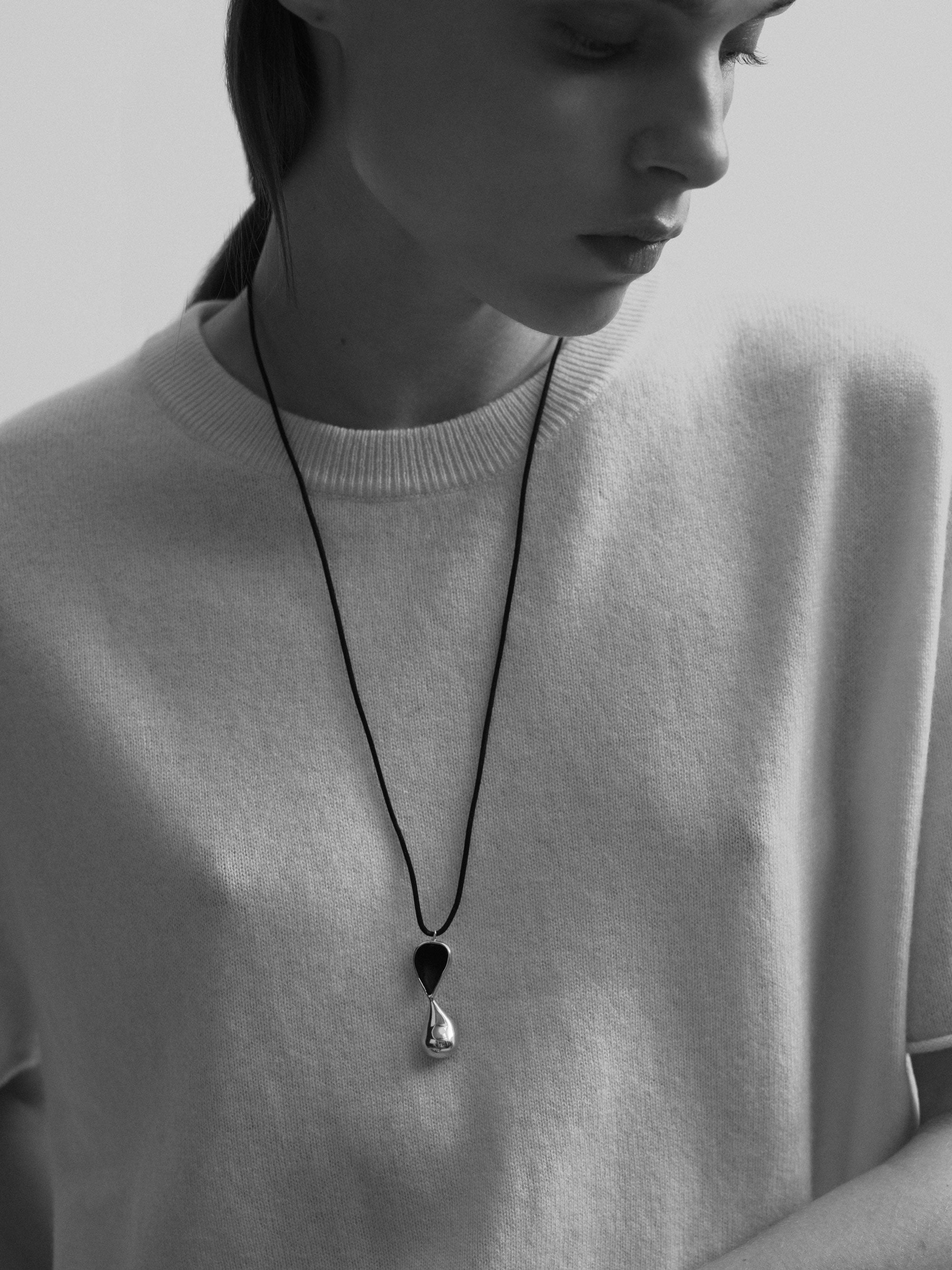 Model wearing .925 Sterling Silver AGMES Inti Pendant