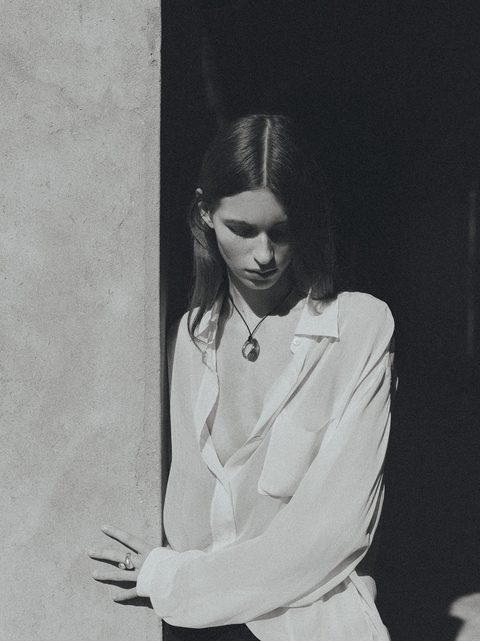 Woman wearing AGMES 0.925 Sterling Silver Marta Pendant with Black Suede Cord. 