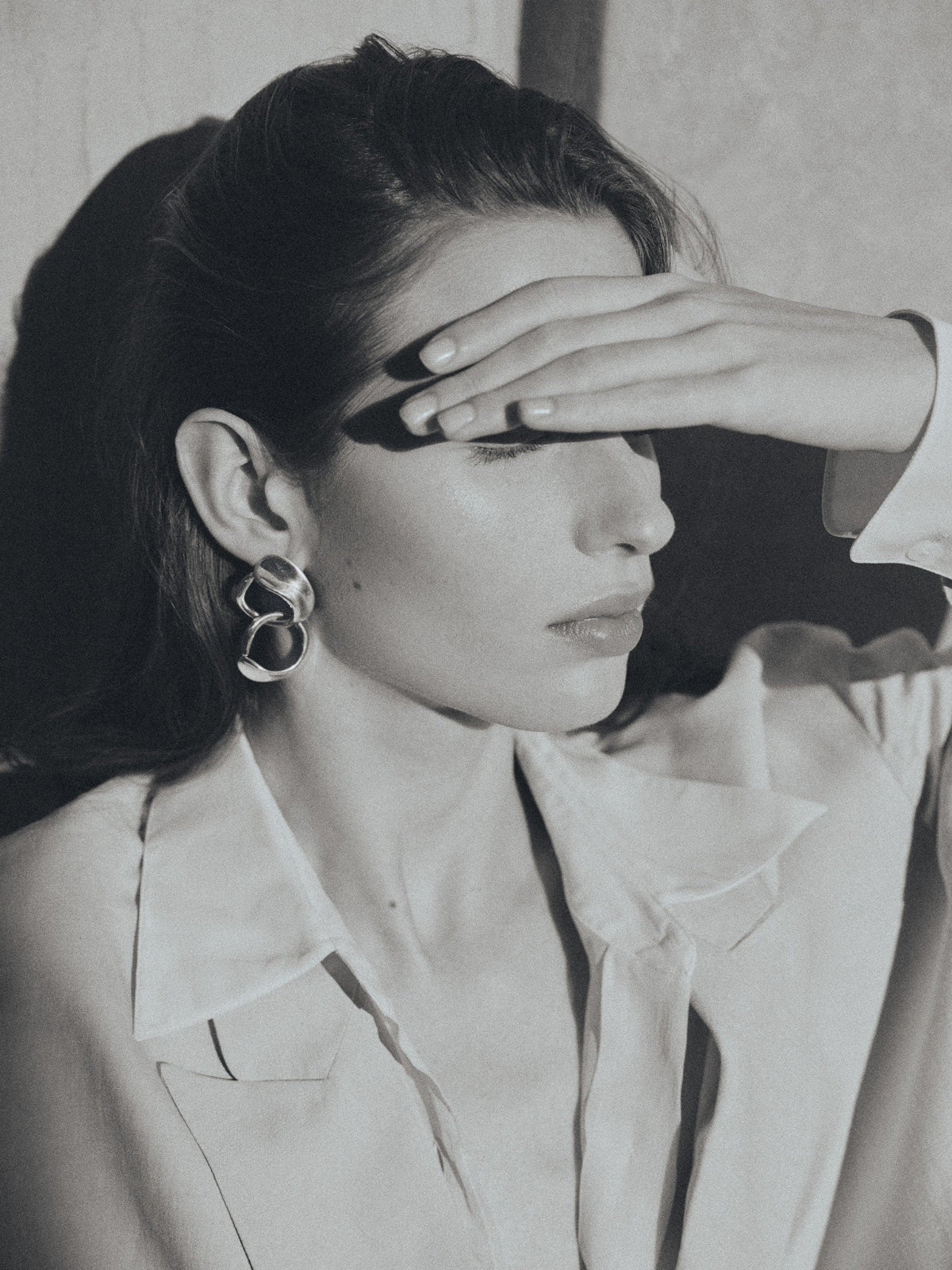woman wearing AGMES 0.925 sterling silver long hoop Marta earrings